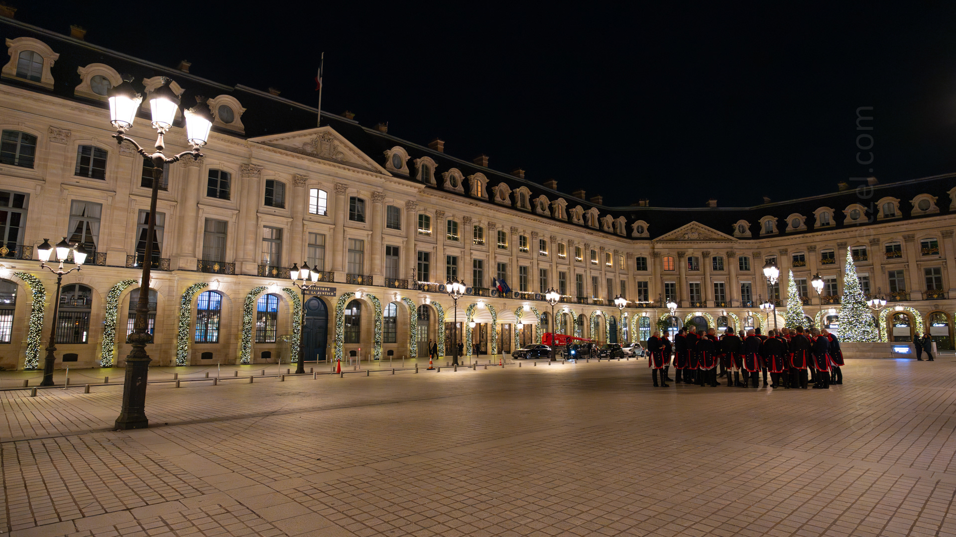 Place Vendôme, at the center of which stands the Colonne Vendôme. There had been an event in one of the buildings there, and this troupe of musicians had just packed up their bus and were preparing to depart.