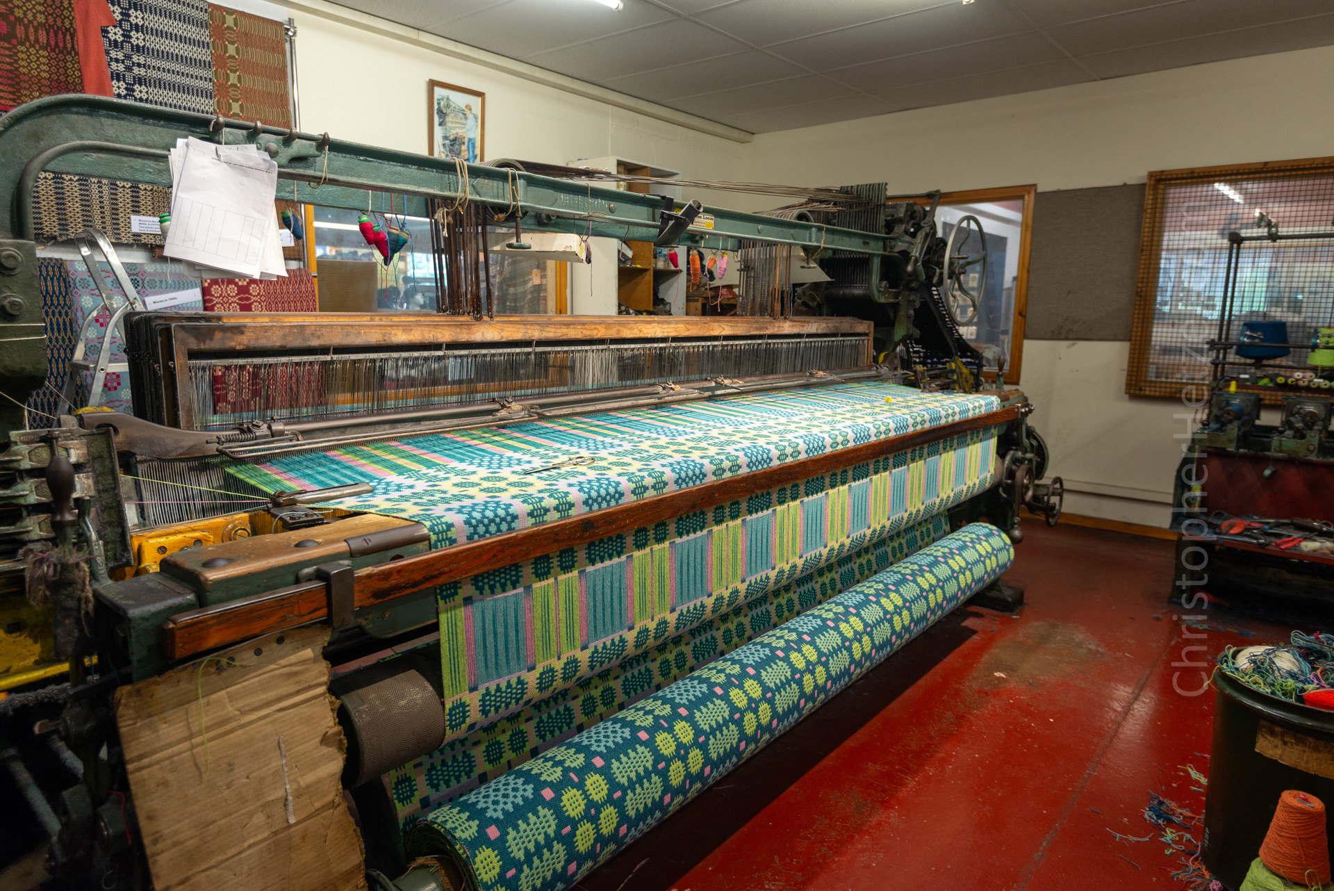 Weaving - The weaving of cloth is done by a loom, which utilizes as many as five shuttles to carry the weft thread horizontally across the vertical warp, while the shafts are raised and lowered to make the pattern.
