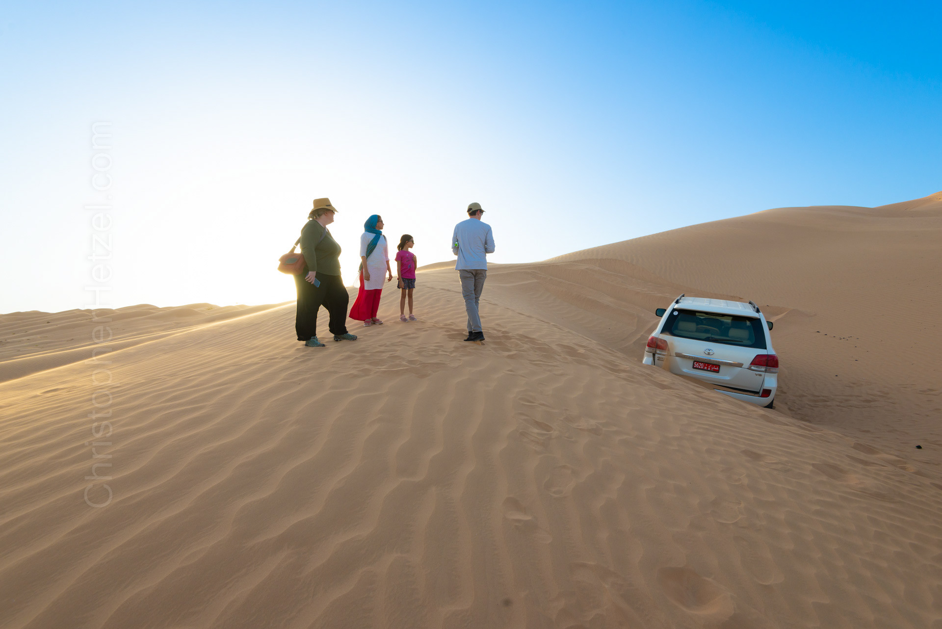 Our driver got our vehicle stuck in the sand.