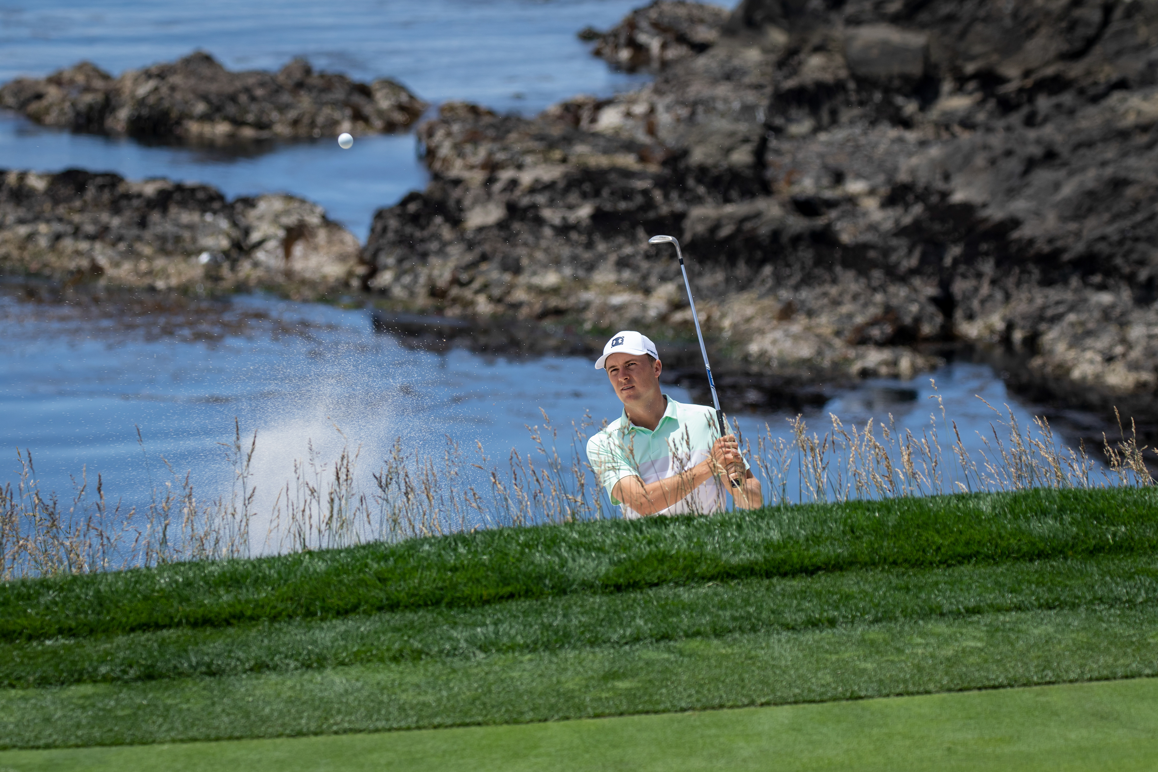 Jordan Spieth hitting a bunker shot