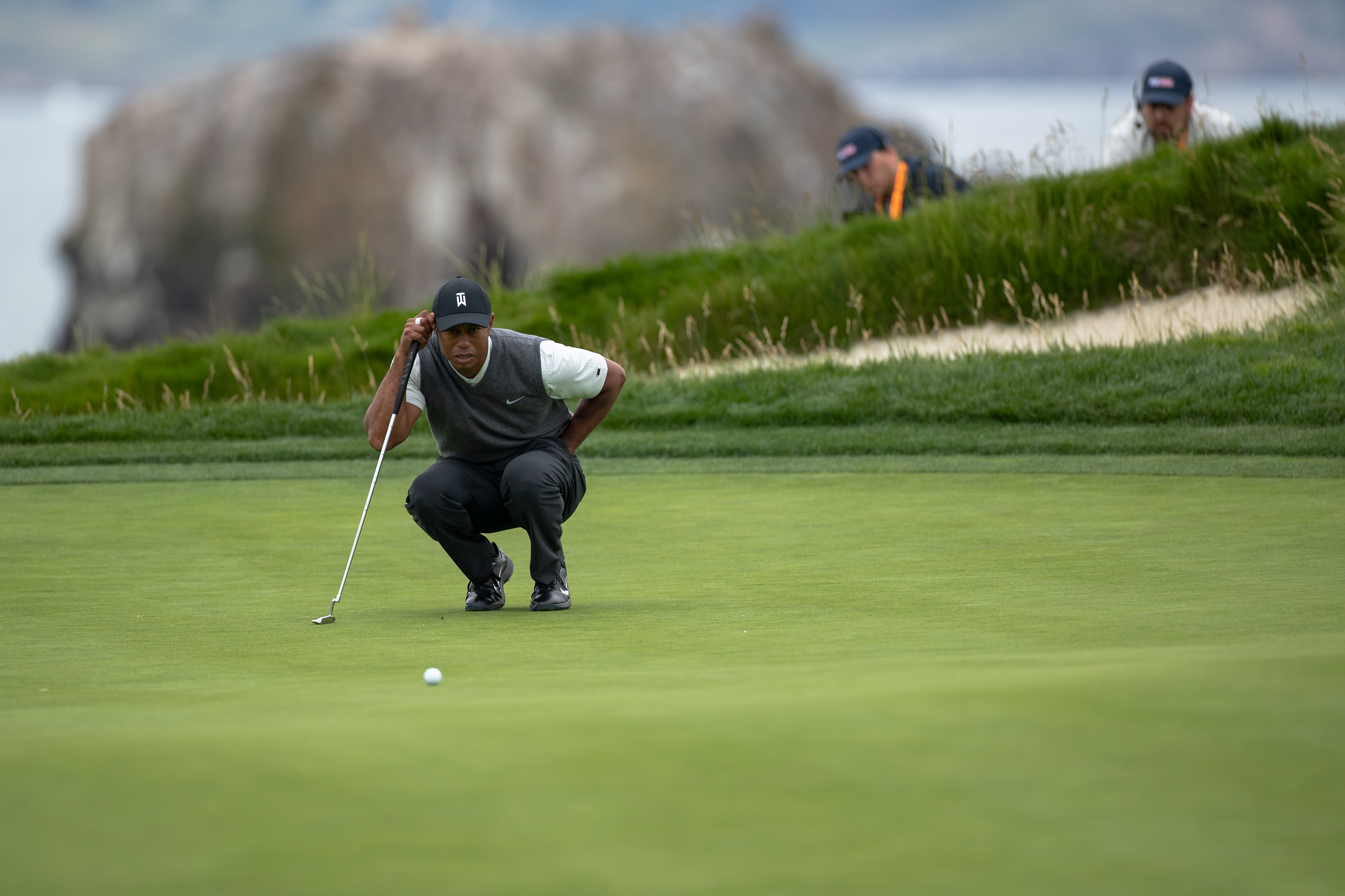 Tiger Woods lining up a putt on hole 17