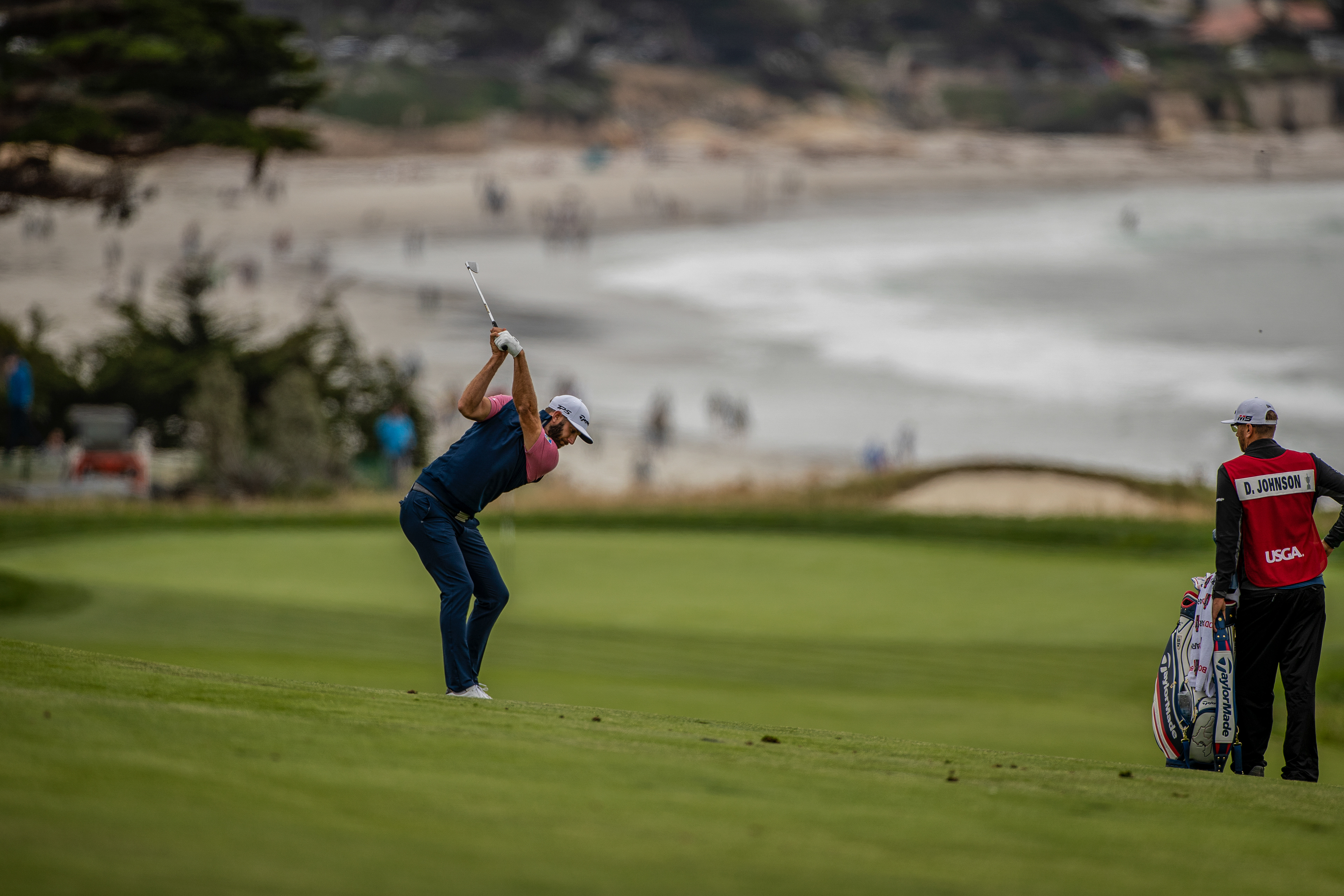 Dustin Johnson hitting a fairway shot to the 10th green