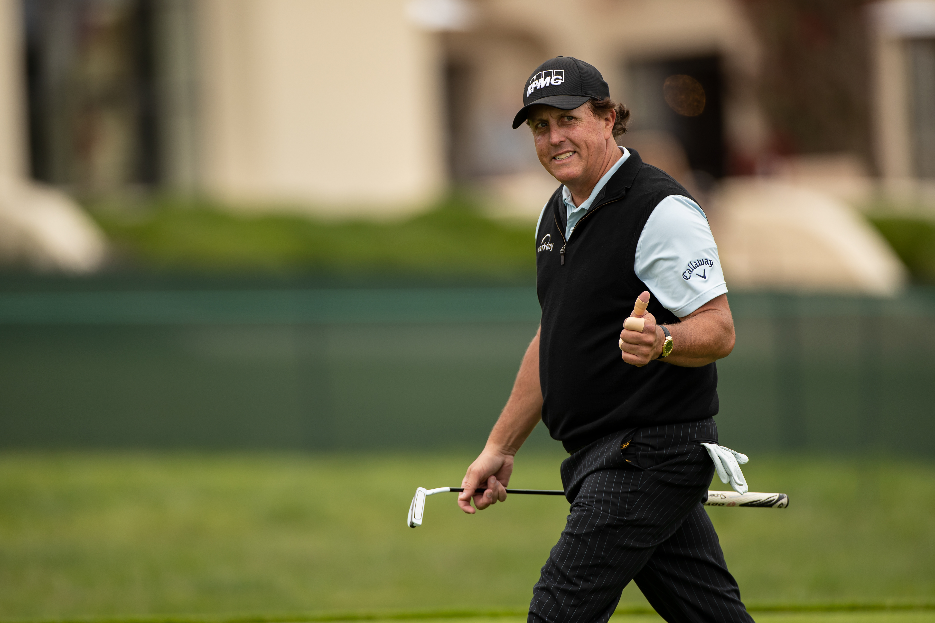 Phil Mickelson gives a thumbs up to fans