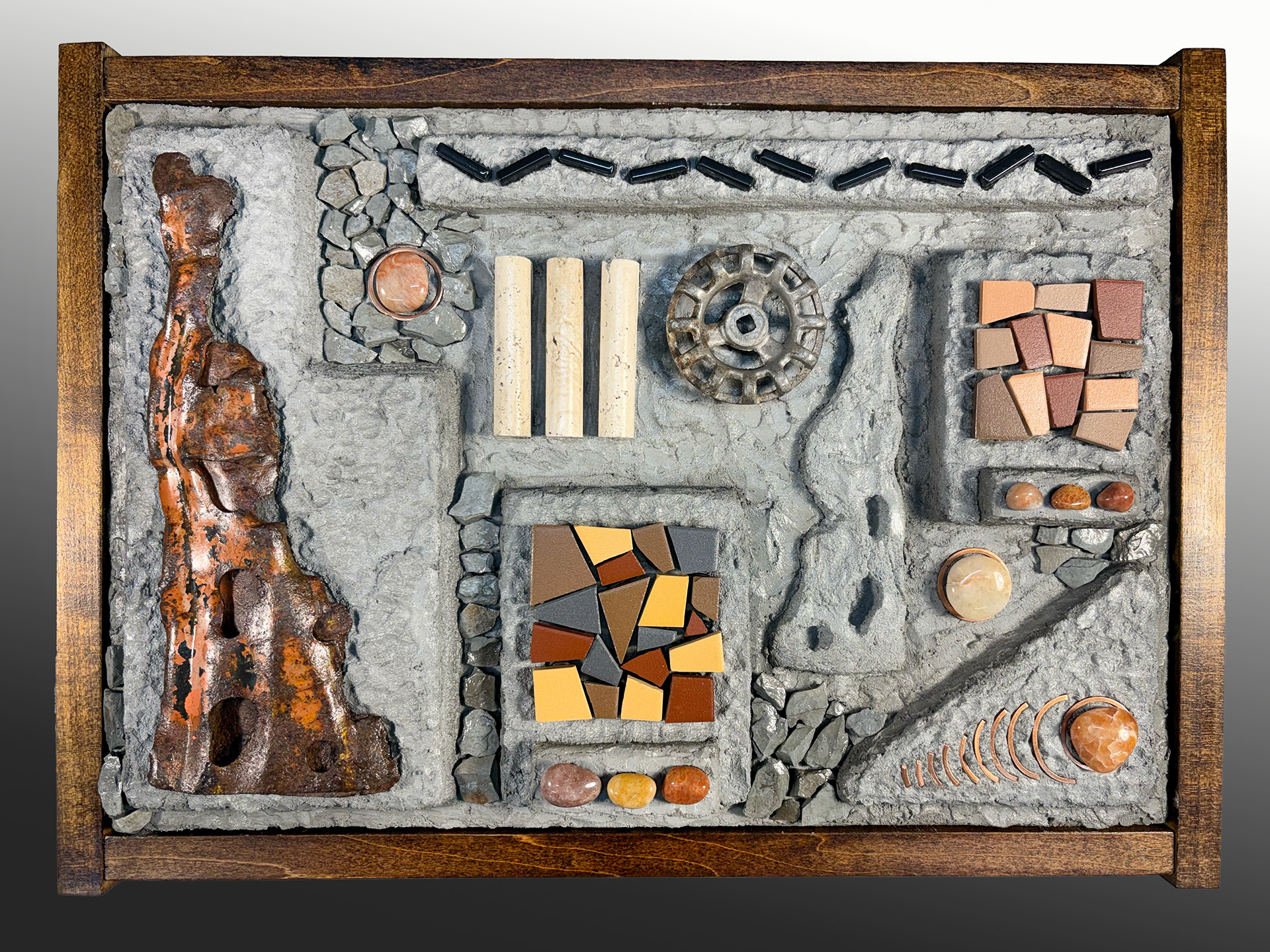"Sample Board"    19.5"x14.25"x3"     2026    Found objects, porcelain and glass tile, tumbled creek quartz, travertine rods and slate chips over carved concrete/wediboard. Stained poplar frame.  