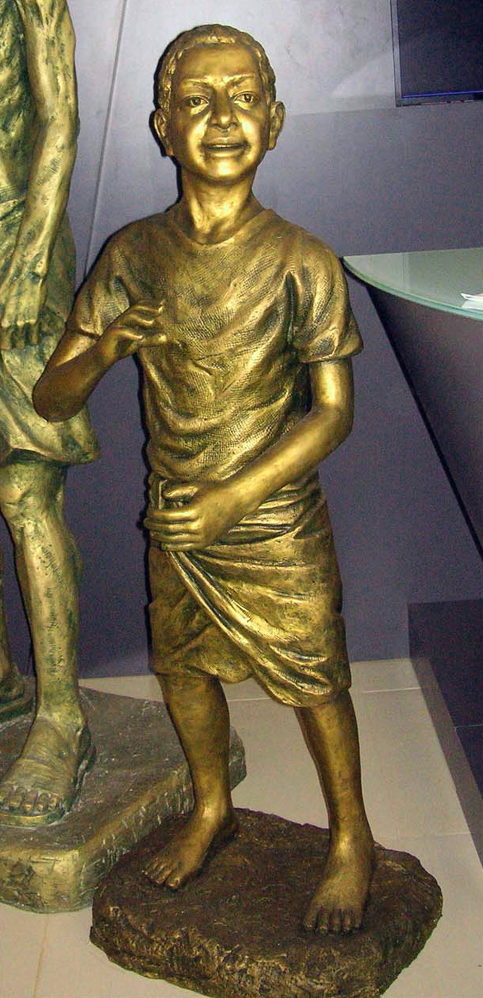 Indian Boy . Cast Resin with Paint