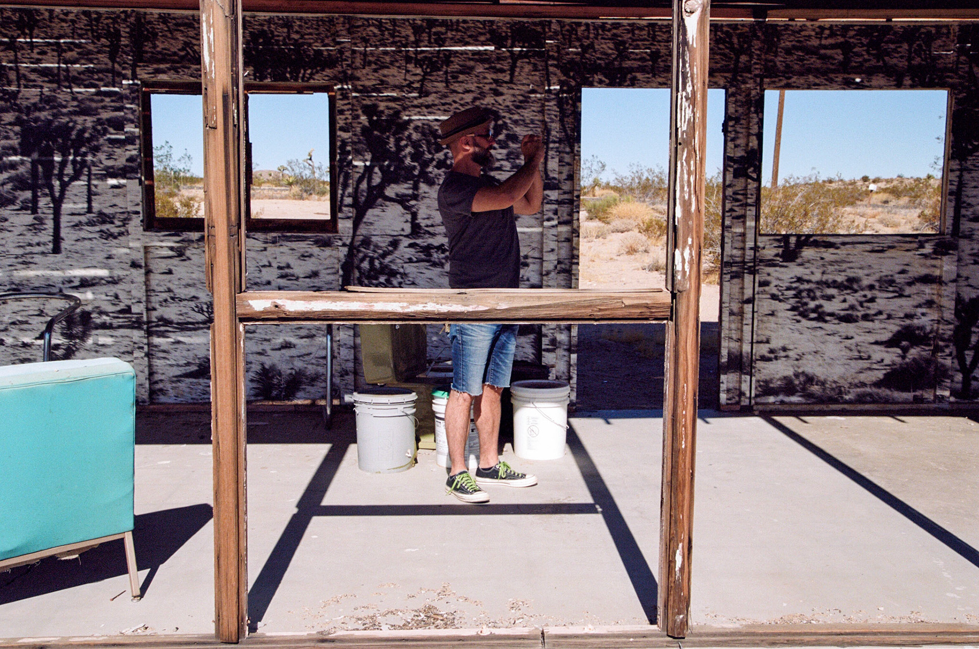 The interior is lacquered with billboard material about Joshua Trees and the exterior with images of dead fish from a Salton Sea die-off.
