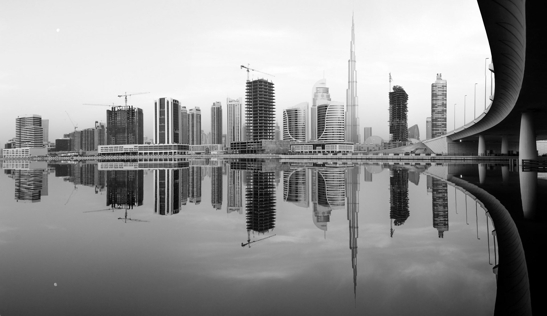 This location in Business Bay is one of the most popular in Dubai. I captured this very still morning in March 2014. A slightly different crop and conversion to black-and-white changes the drama of the scene.