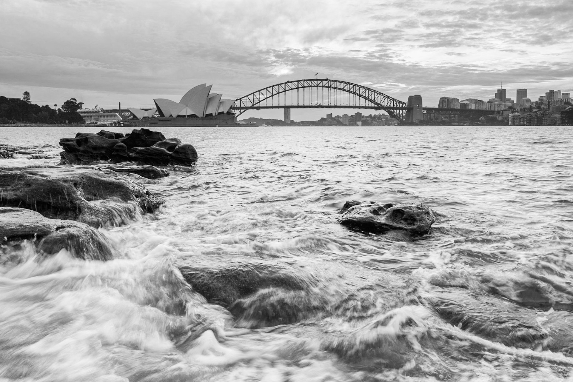 The sunset this evening didn't have a lot of colour, which suited black-and-white photography. This picture is taken from the rocks at Mrs Macquarie's Chair on Farm Cove.