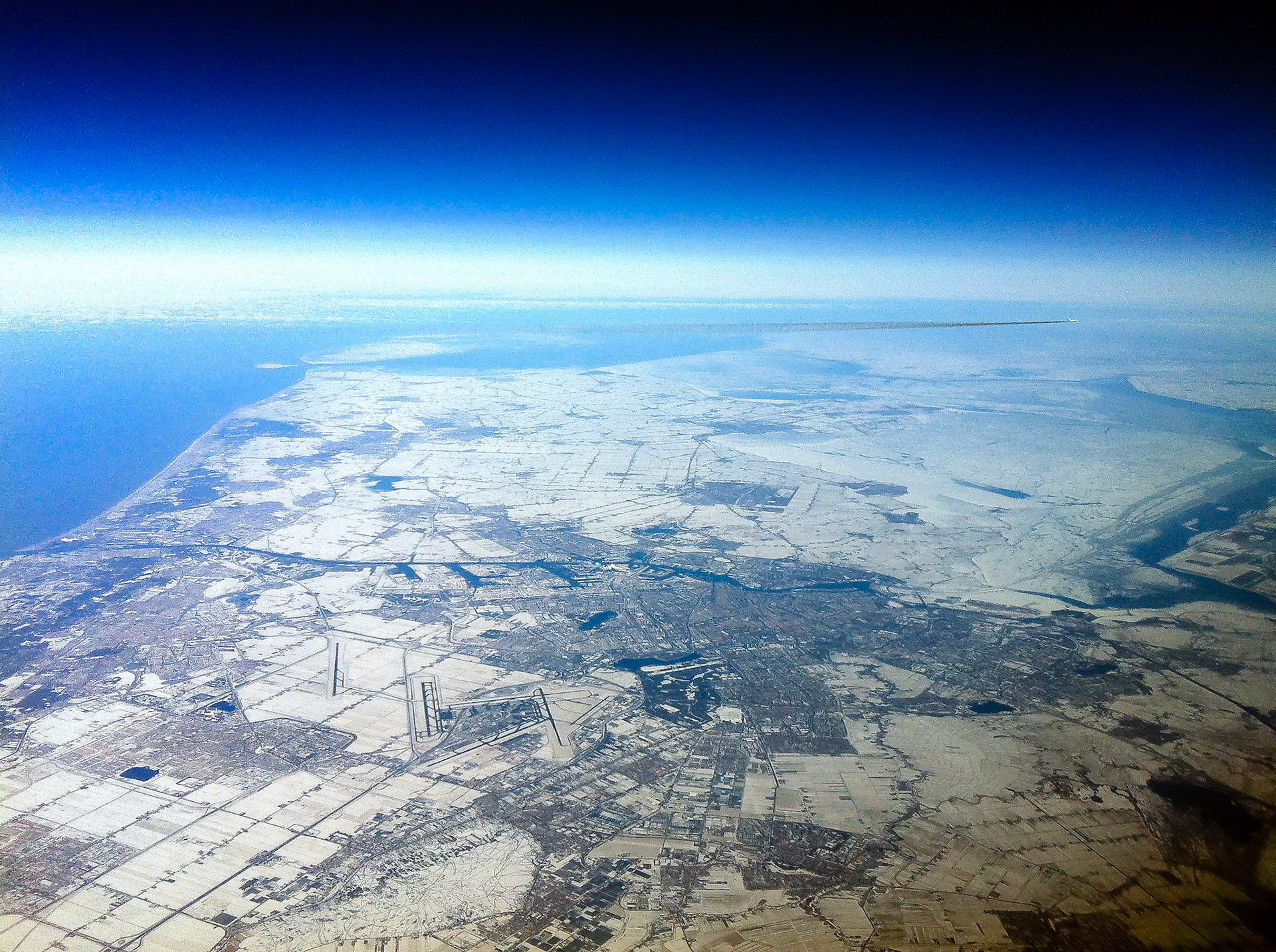 Mid-February over Europe and this view captures half of The Netherlands and all of Amsterdam. Amsterdam Airport- Schipol- can be seen just left-of-centre