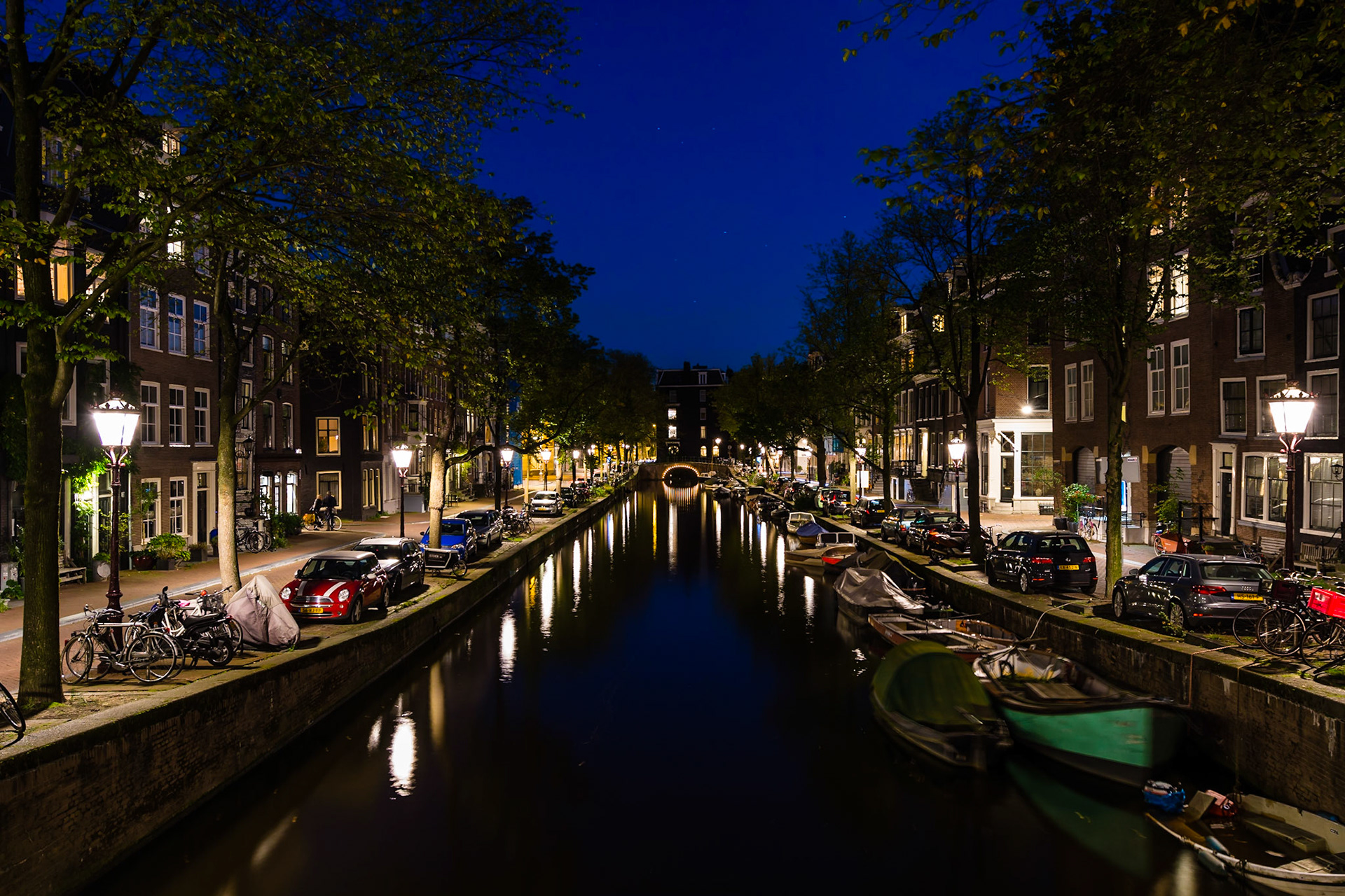 Reflection on the waterways of Amsterdam after sunset.