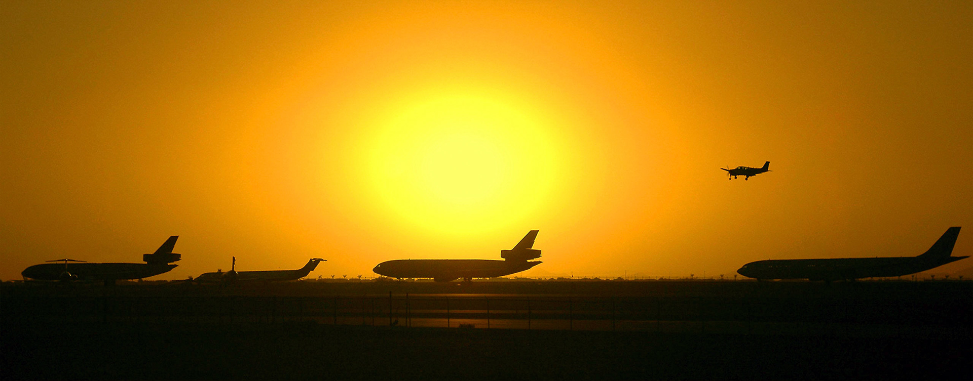 A Piper Warrior landing at Goodyear Airport, Phoenix, AZ. Decomissioned airliners are stored in the background.  Homepage: <a href="http://www.richardbrew.com">RichardBrew.com</a>Facebook: <a href="https://www.facebook.com/richardbrewphotography">Facebook</a>Twitter: <a>Twitter</a>Google+ <a href="https://plus.google.com/u/0/112745305766235730672">Google+</a>
