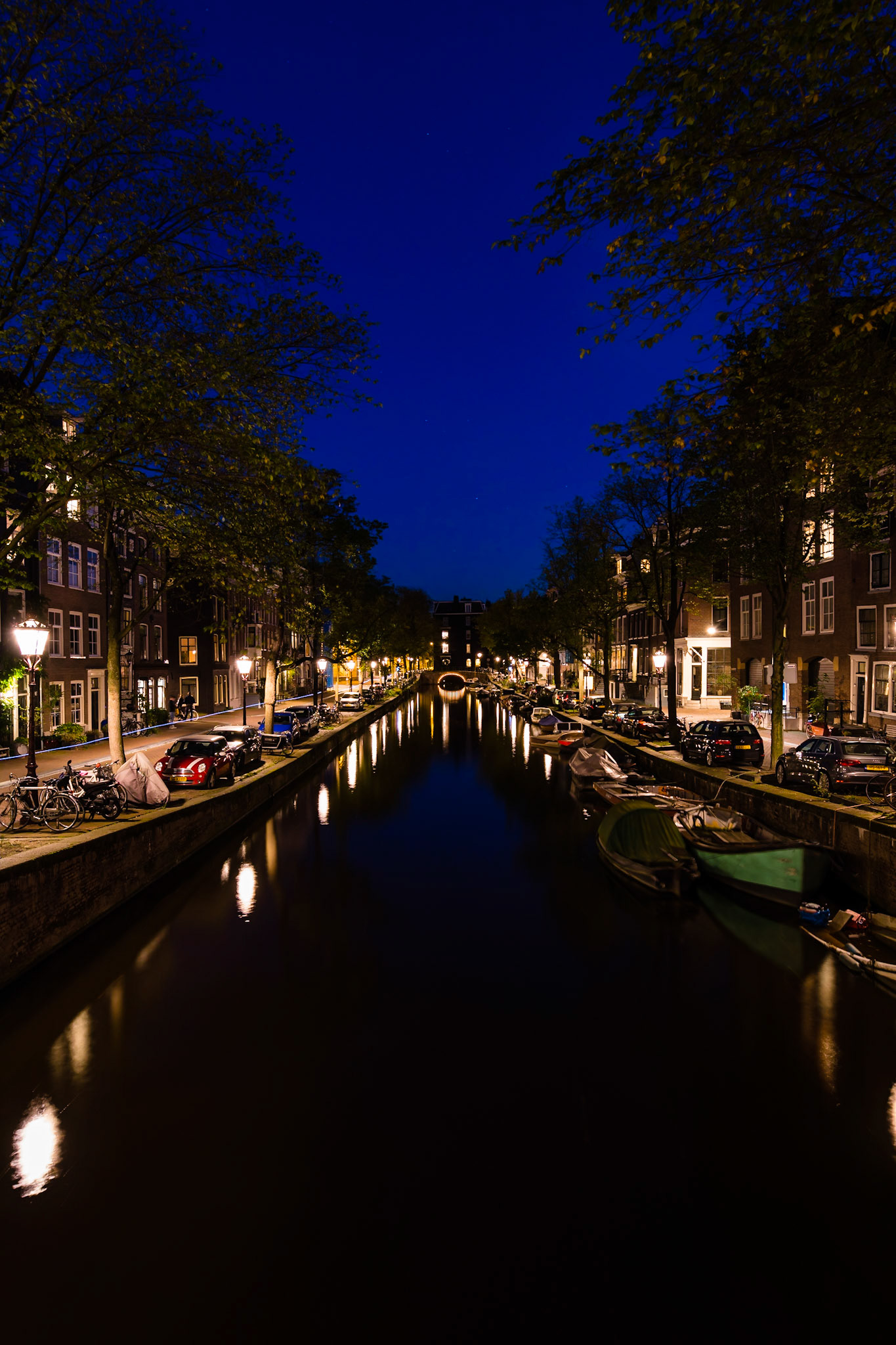 Reflection on the waterways of Amsterdam after sunset.