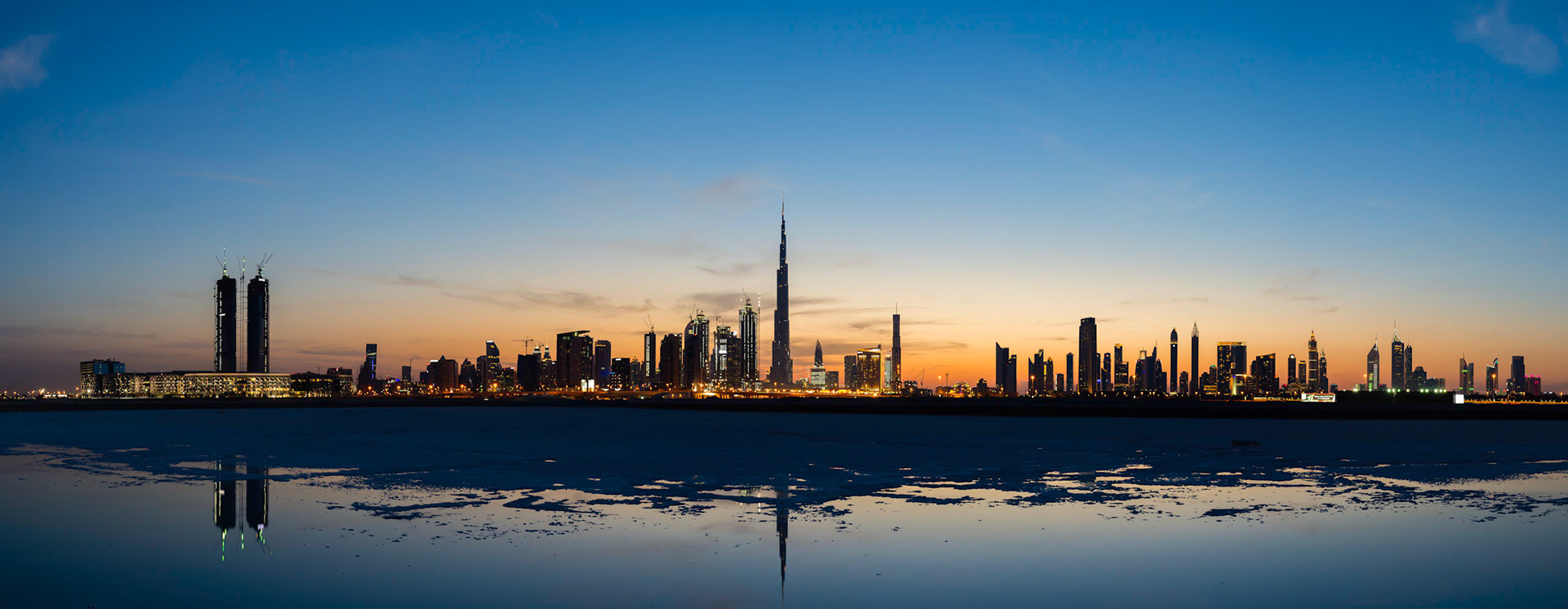 This panorama of Dubai was taken just after sunset. As the sky darkens, you can see the lights of Dubai coming on.