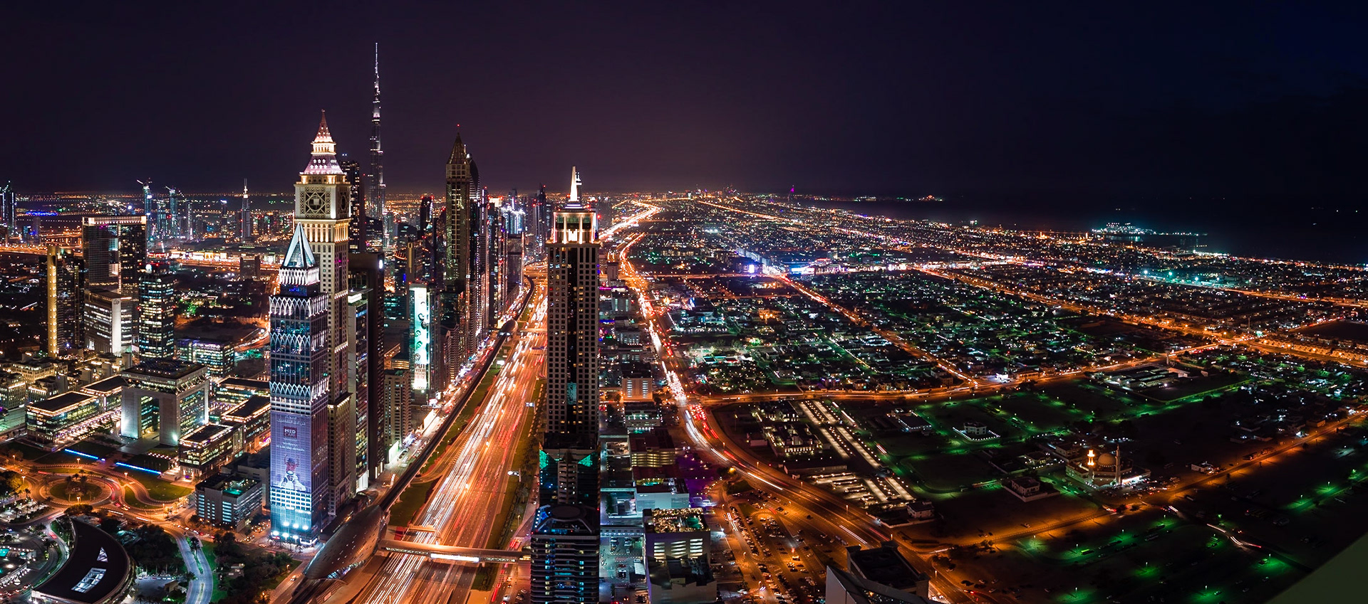 After a day of poor visibility, the sky cleared enough in the afternoon to provide a beautiful sunset over Dubai. The view looks southbound, past the Dubai International Finance Centre and Burj Khalifa towards the Burj Al Arab and Dubai Marina.