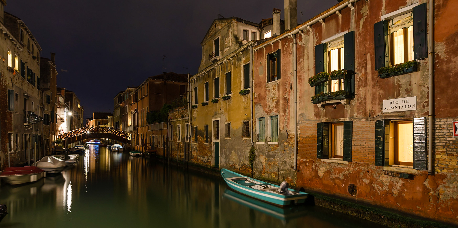 This view shows the condition and history of the houses and commercial units along the side of Rio de San Panatalon in the Dorsoduro district of Venice.