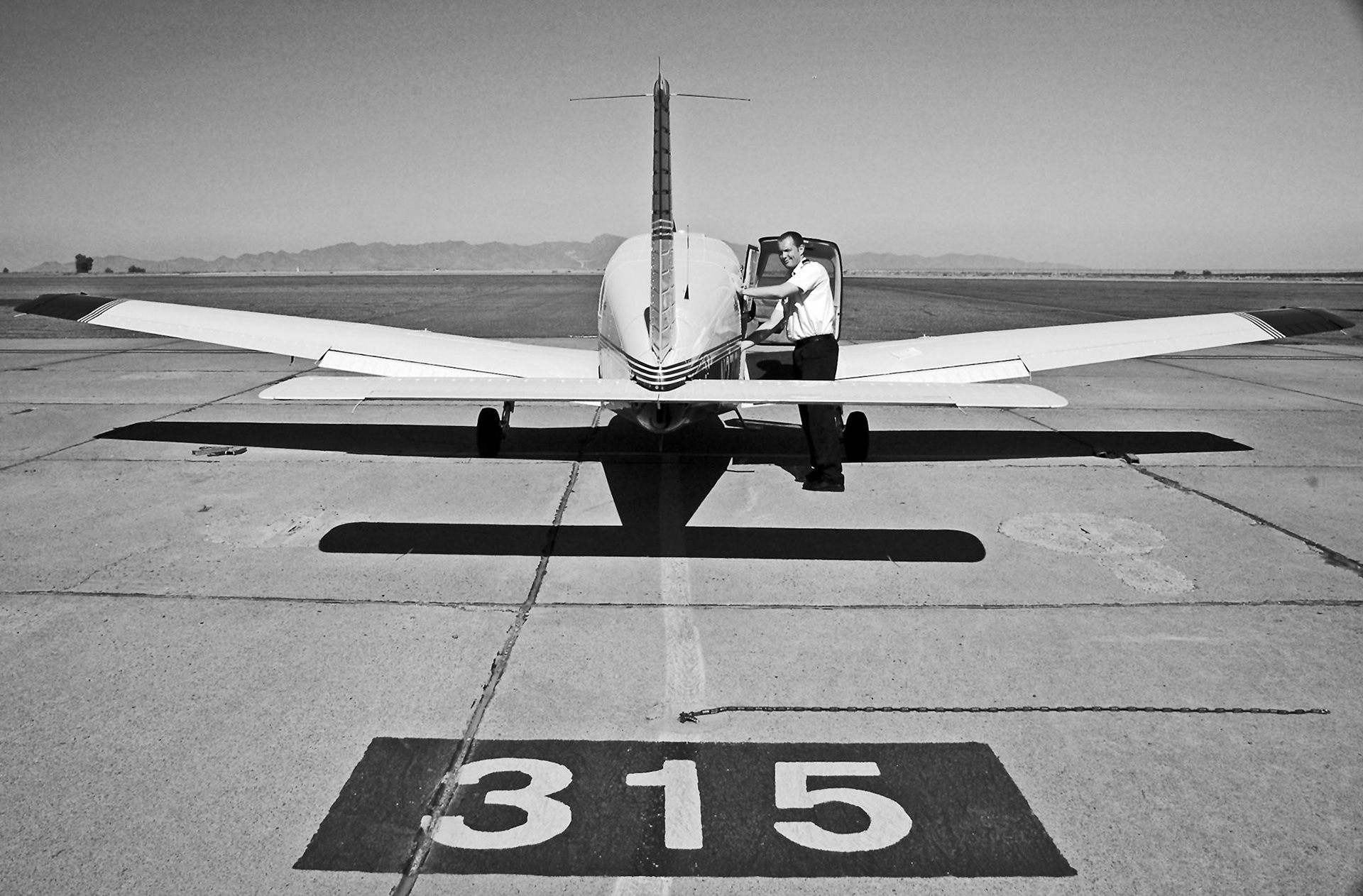 While training in Arizona, I captured this picture of a friend completing pre-flight checks.