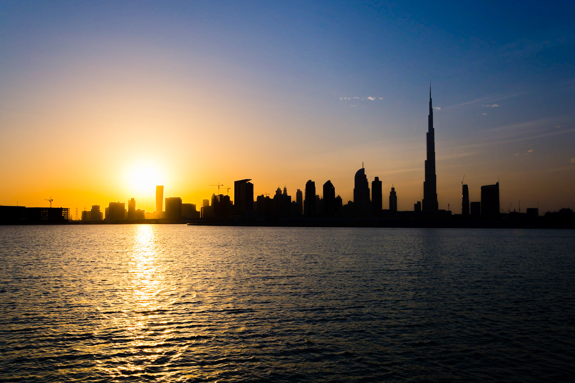 The Dubai Skyline at sunset taken from Dubai Creek, near the Ras Al Khor wildlife sanctuary