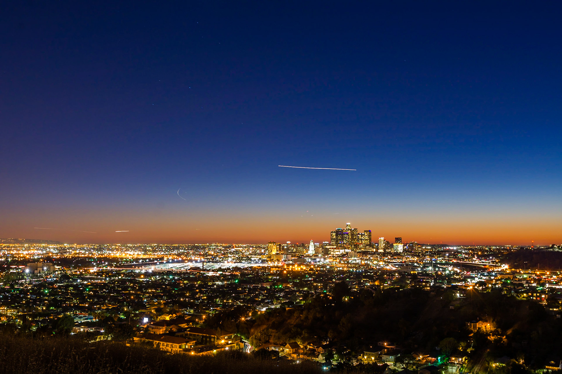 Shortly after sunset the magnitude of Los Angeles becomes apparent. The skies above are busy with aiircraft flying into LAX