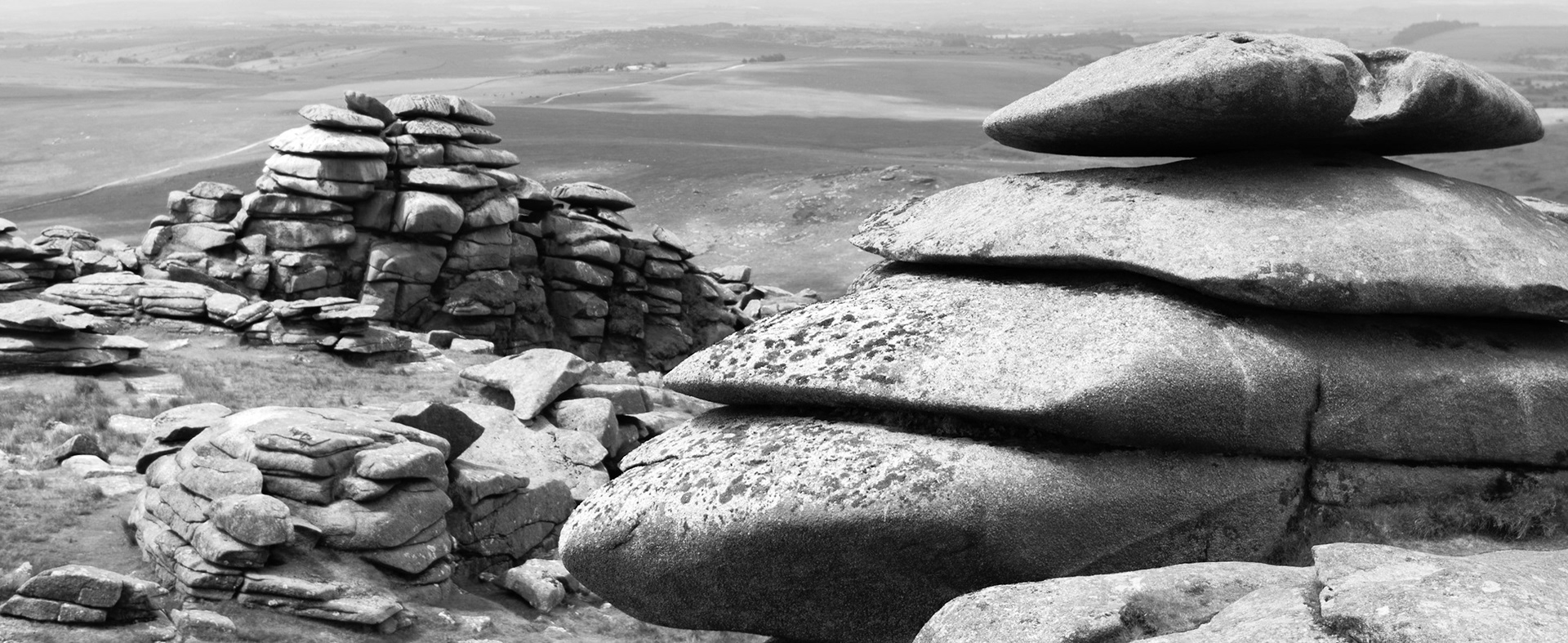 A view of the massive weathered granite blocks that perch on the top of Rough Tor on Bodmin Moor.