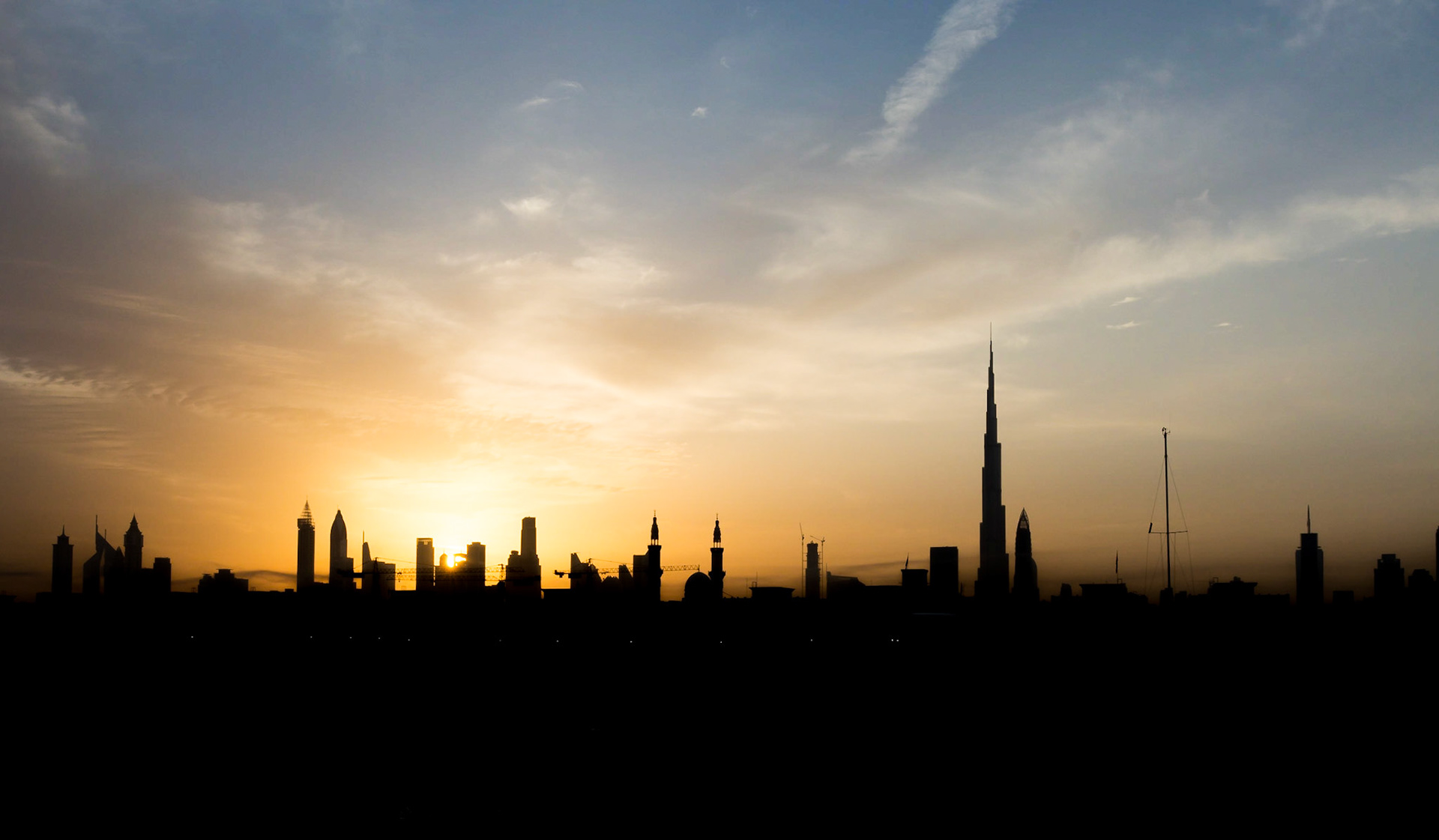 Sunrise over Jumeirah Fishing Village in Dubai, UAE. The Fishermans Village is a quiet spot in the Dubai coastline, featuring the harbour, cafes, restaurants and boat-building.
