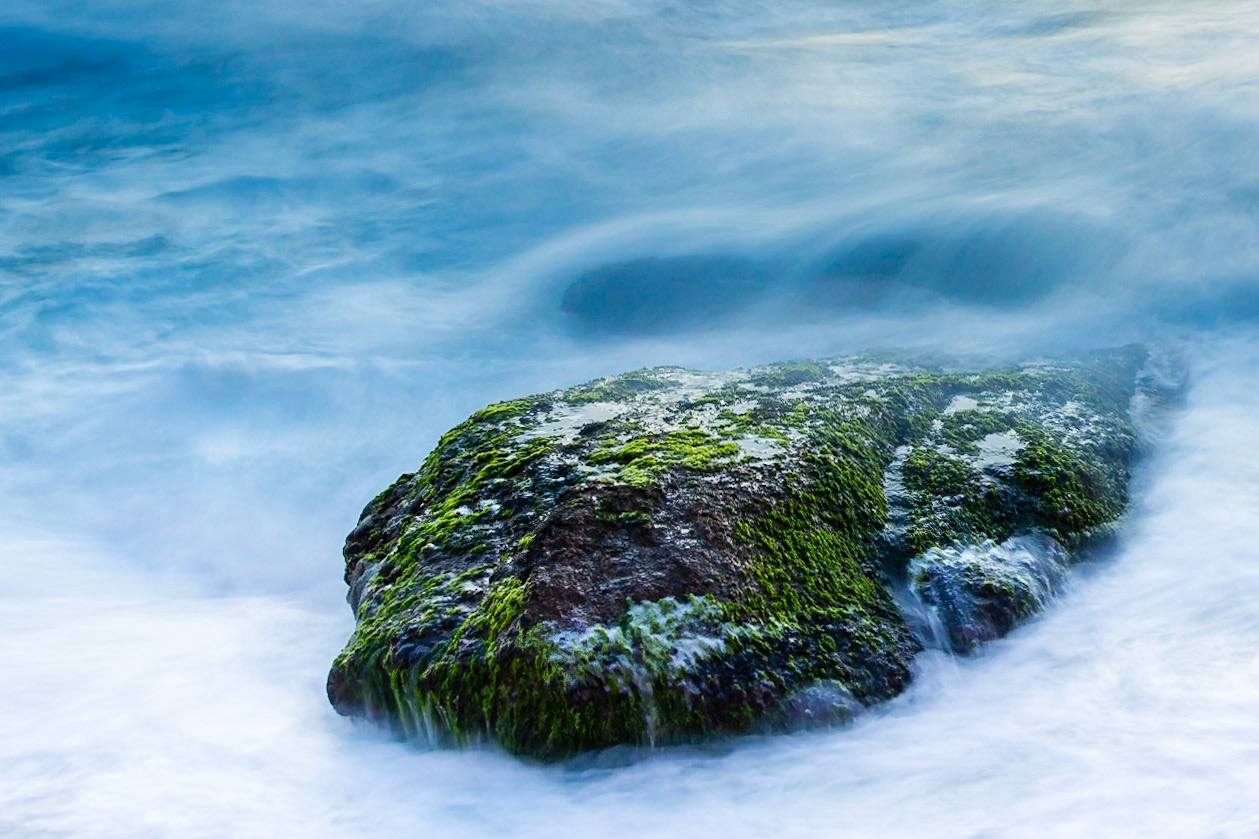 While watching the sunrise at Ipanema Beach I spent some time practicing longer exposures, using this rock as the subject.