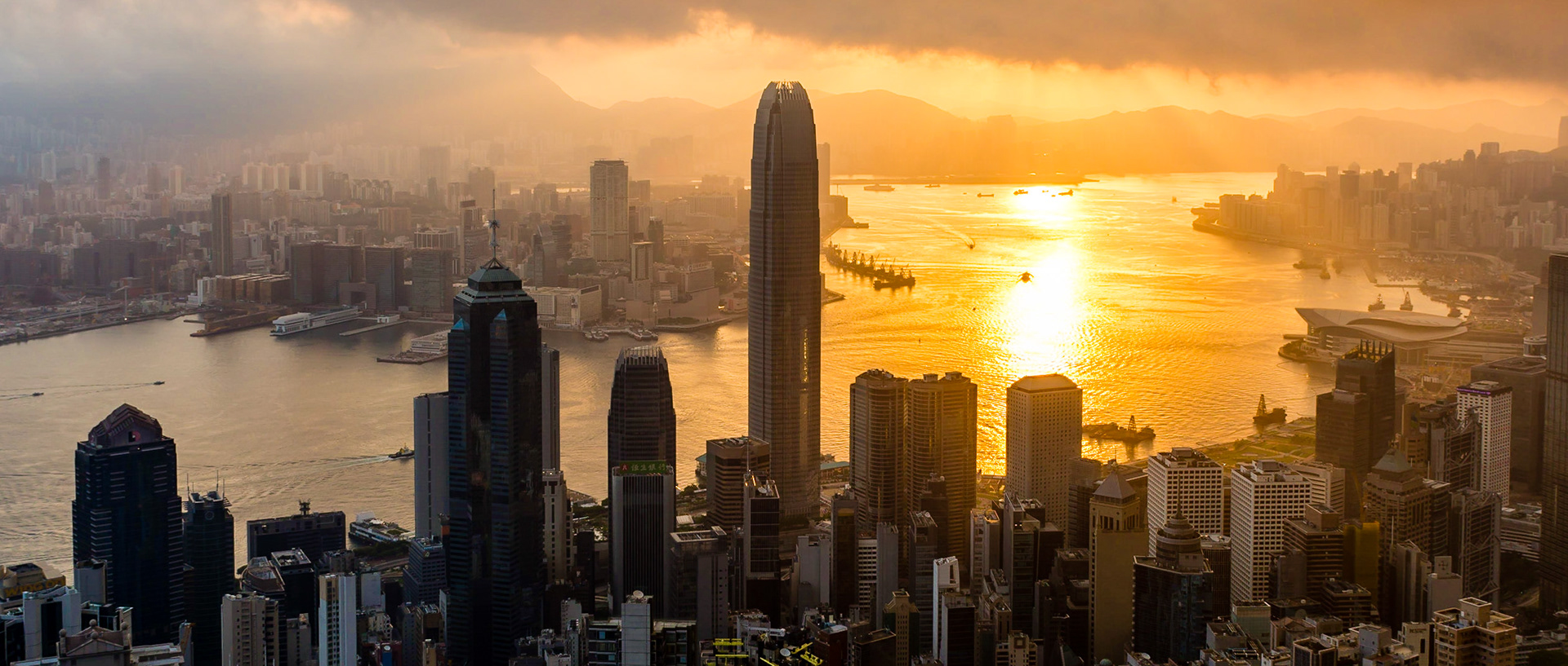 Kowloon Bay is given a golden glow by the sun as it rises over Hong Kong