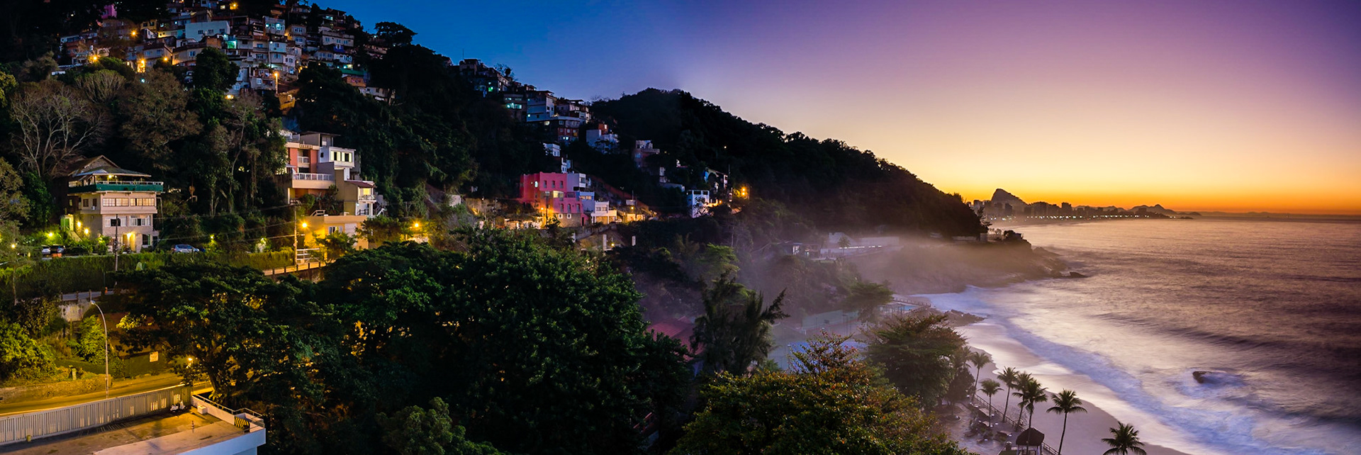 Sunrise in Rio, capturing Ipanema Beach, the town of Leblon and Sugarloaf Mountain.