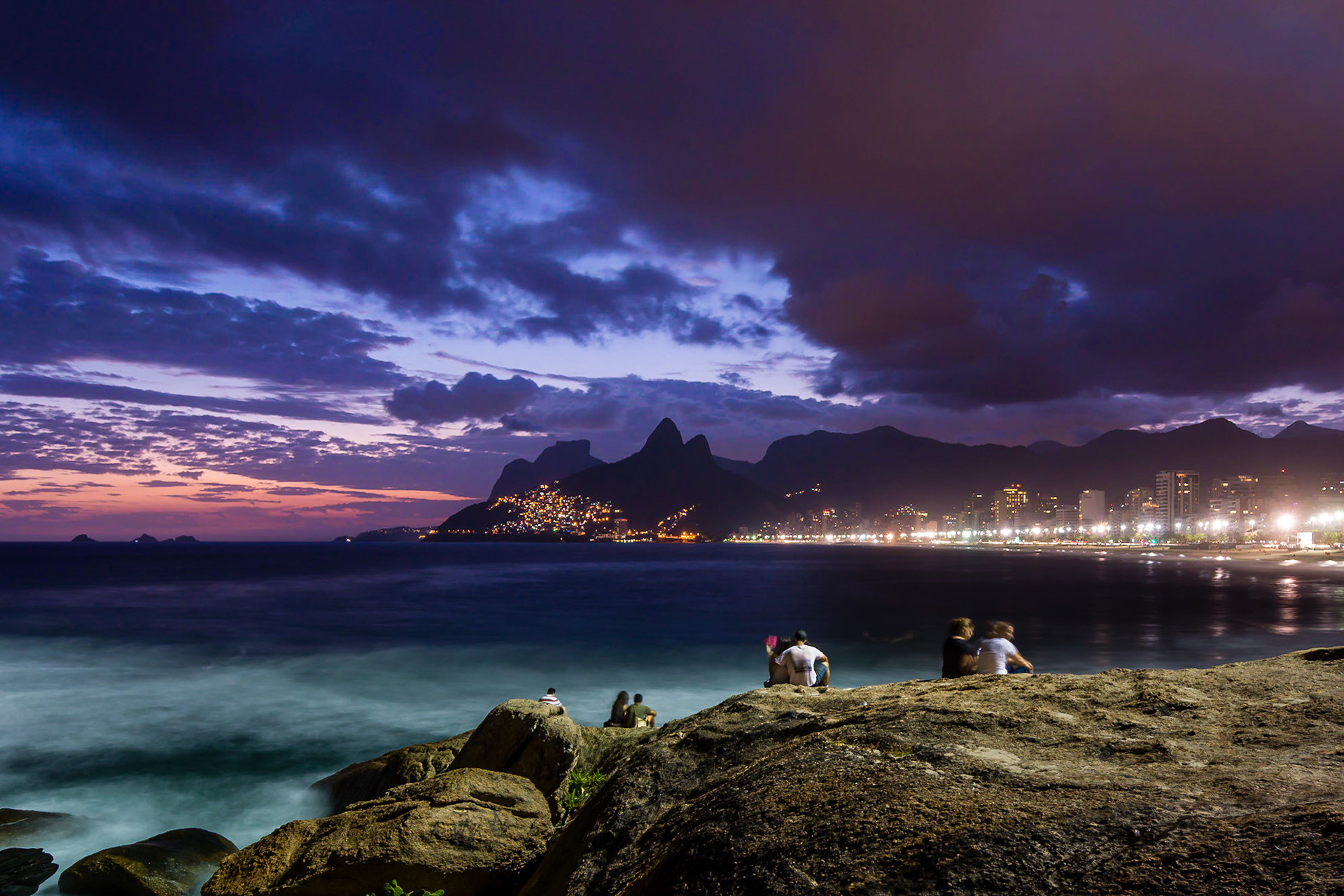 Sunset in Rio De Janiero, with the view of Ipanema Beach from the rocks of Pedra do Arpoador.