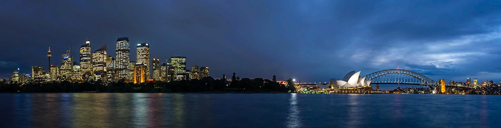 This panorama captures the icons of Sydney and the downtown district at sunset.