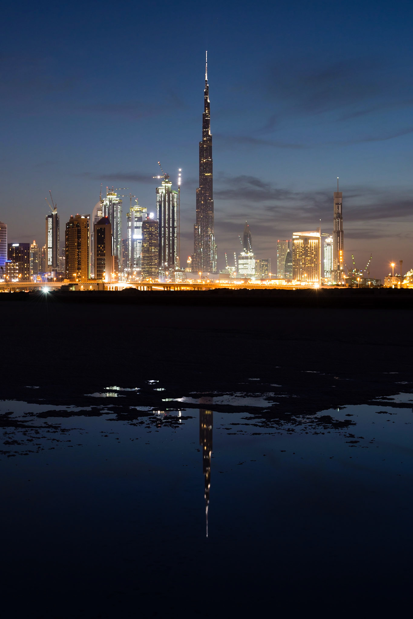 This is one in a series of photographs that capture Dubai at sunset from the newly-developed Design District in Dubai. This part of Dubai Creek has been dammed and most of the water has evaporated over time, leaving the salt deposits.