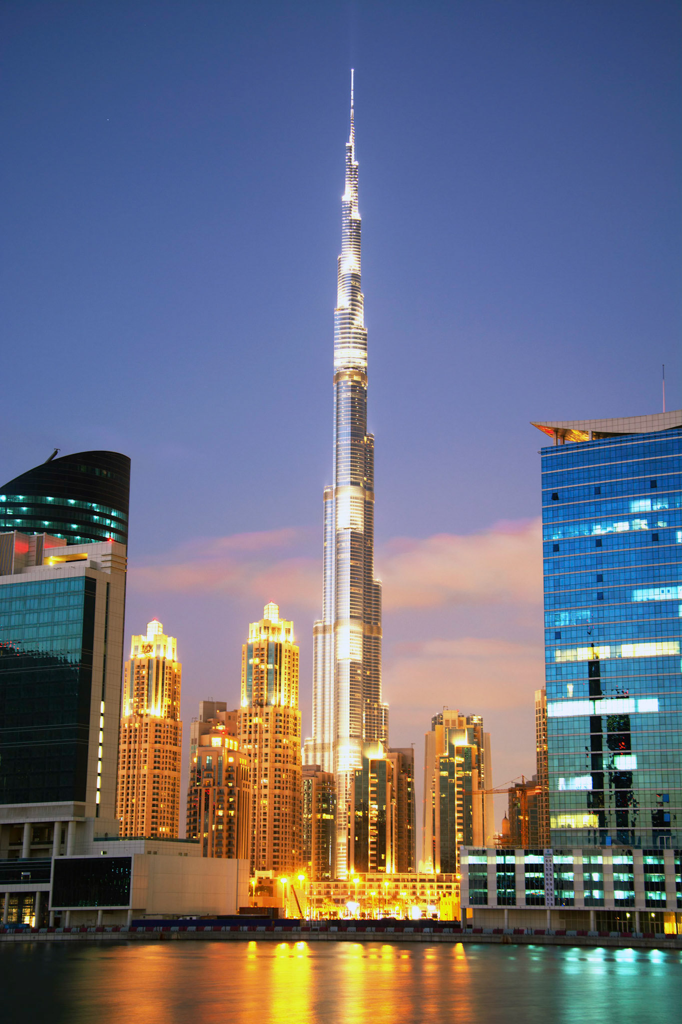 The Burj Khalifa is surrounded by golden buildings in Downtown Dubai.