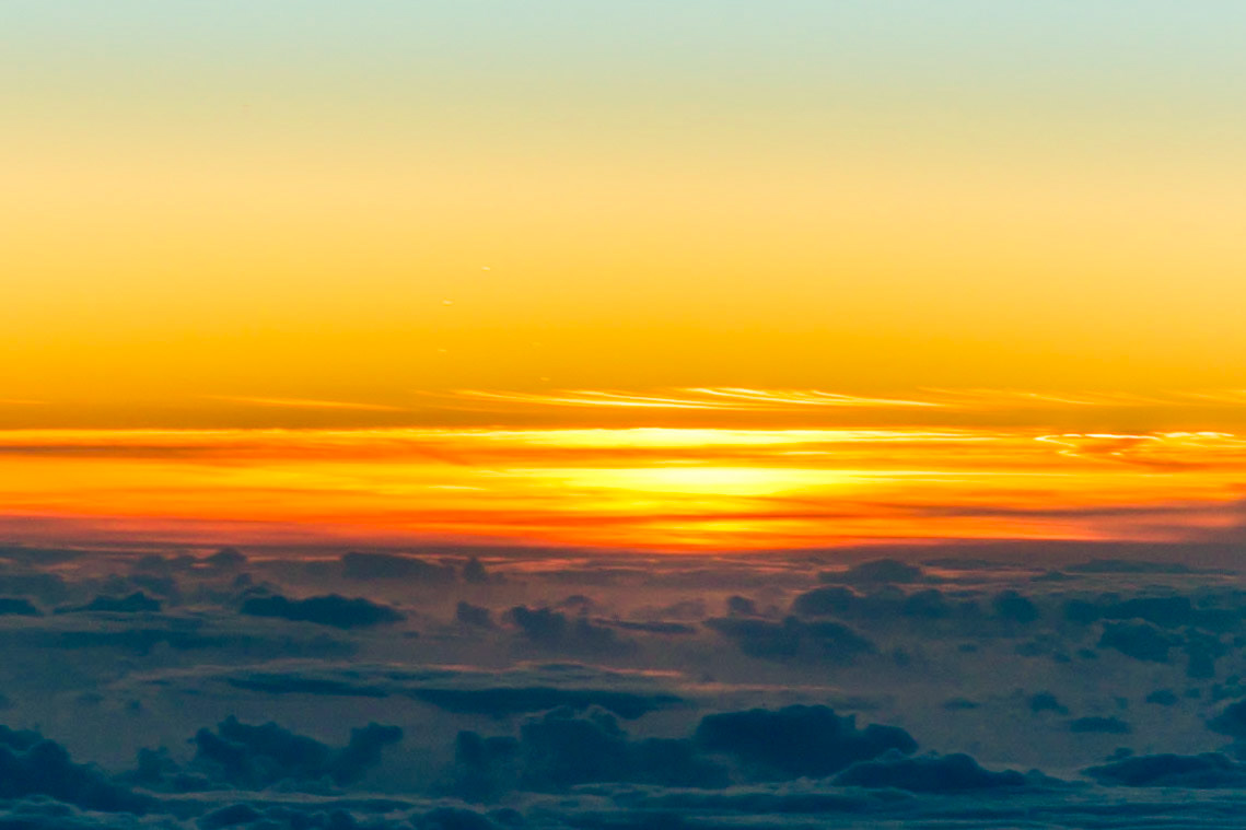 A lot of the flights between Europe and North America have to fly along corridors called 'Tracks'. The specks of light you can see in the sky are actually aircraft ahead of us and offsetting by 1 or 2 miles to the right of track.