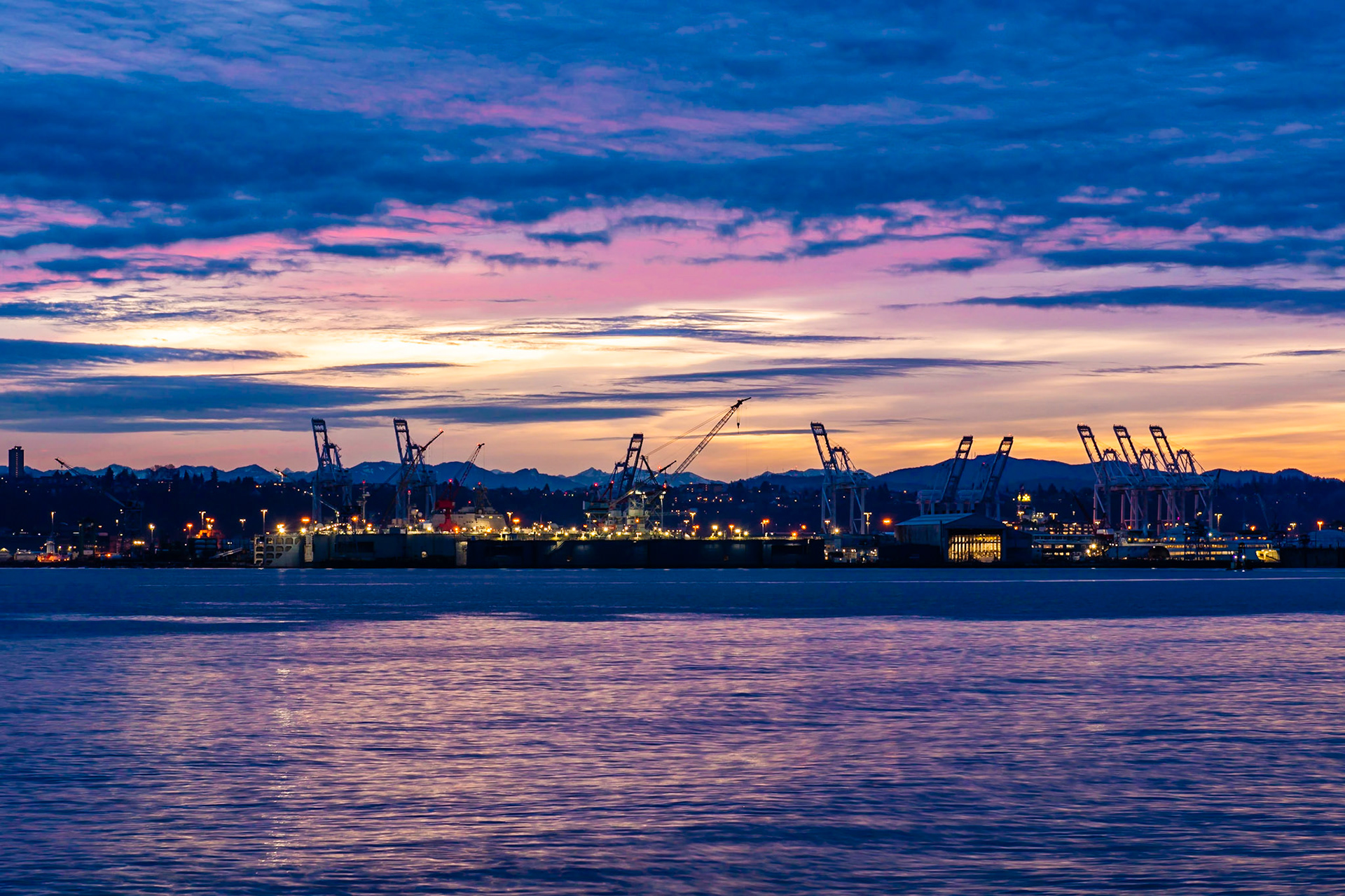 Sunrise in Seattle, Washington State, viewed from Seacrest Park across the bay to Downtown.