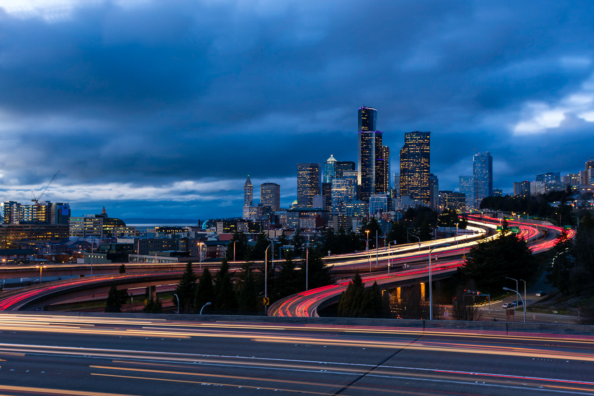 Traffic is busy in Seattle shortly after sunset. This picture is a composite of 5 images.