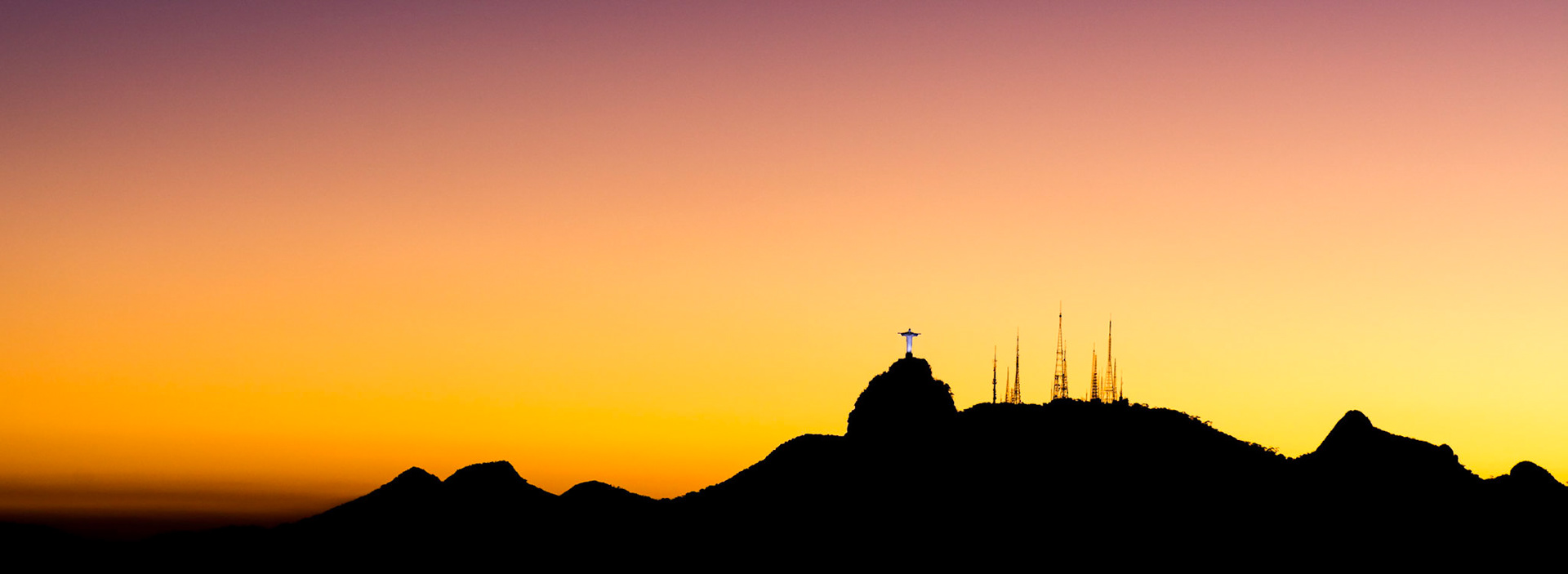 This picture captures the silhouette of the Corcovado hills and Christ the Redeemer.