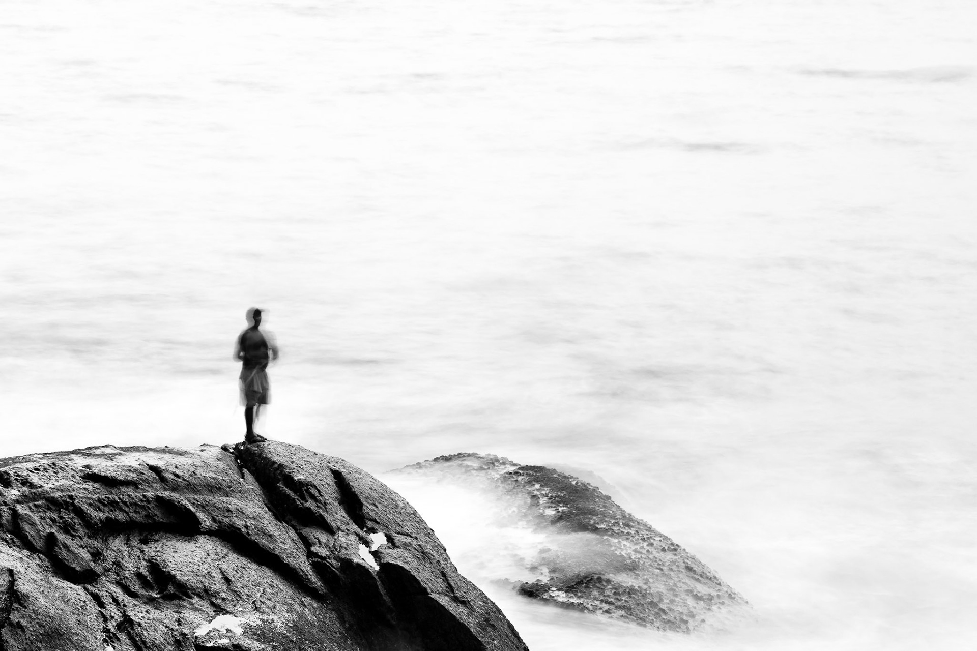 RIO DE JANEIRO, BRAZIL - APRIL 5 2015: Fishermen practice their skill on the rocks of Pedro do Arpoador