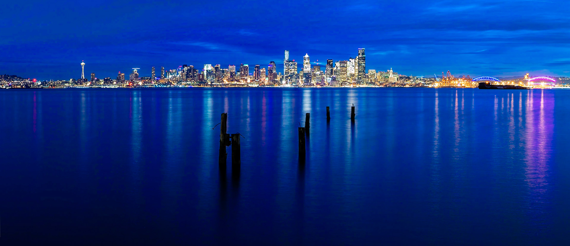 Sunrise in Seattle, Washington State, viewed from Seacrest Park across the bay to Downtown.