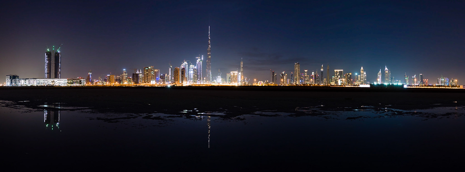 This is one in a series of photographs that capture Dubai just after sunset from the newly-developed Design District in Dubai. This part of Dubai Creek has been dammed and most of the water has evaporated over time, leaving the salt deposits.
