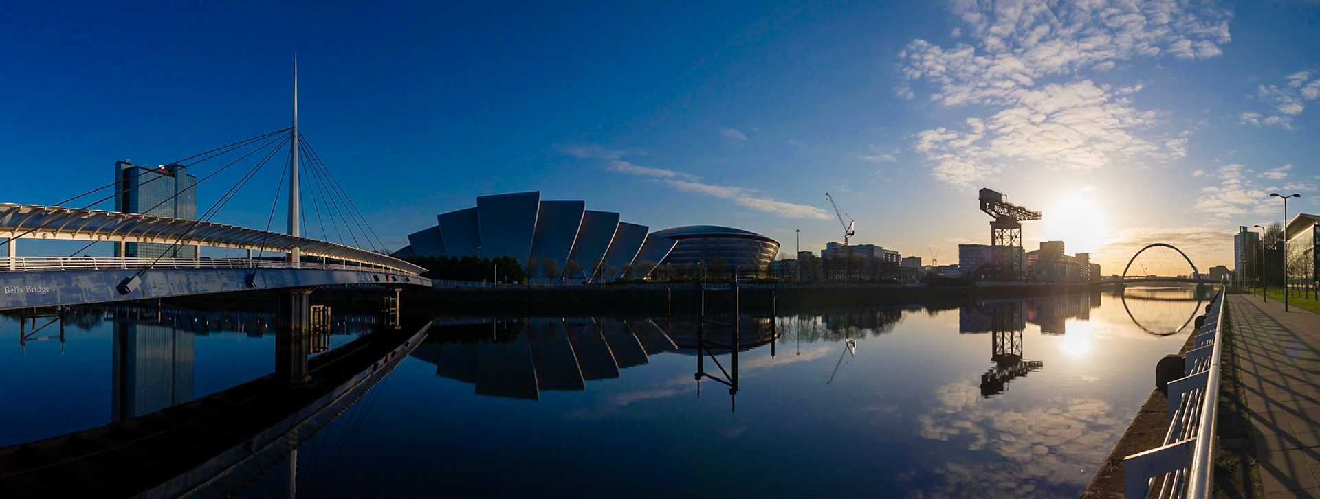 The view from Bells Bridge, Glasgow, during a springtime sunrise. Including the SSE Hydro, Finnieston Crane and Glasgow Eye bridge.