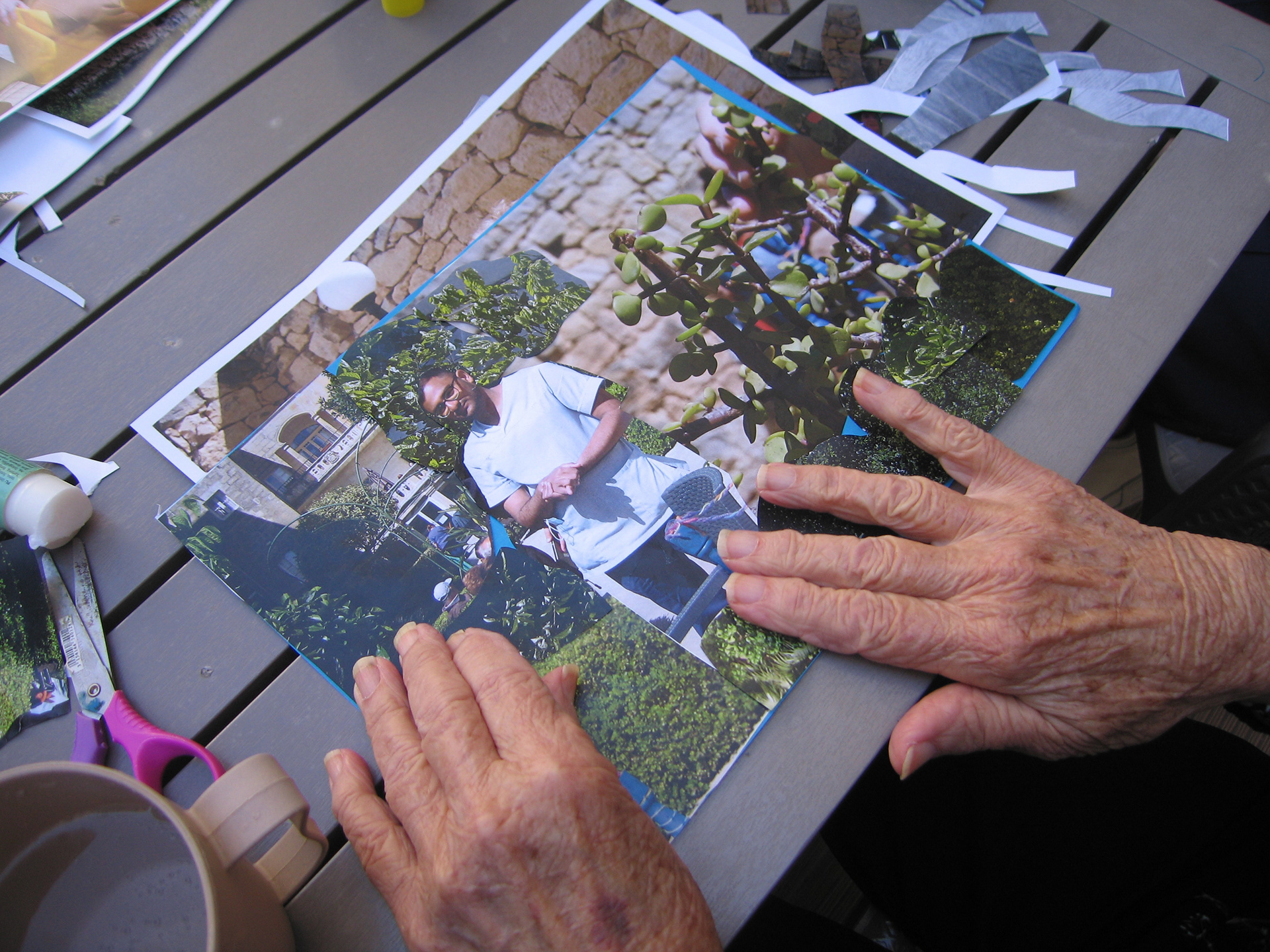 Participant creating a photocollage with photos taken during a previous workshop