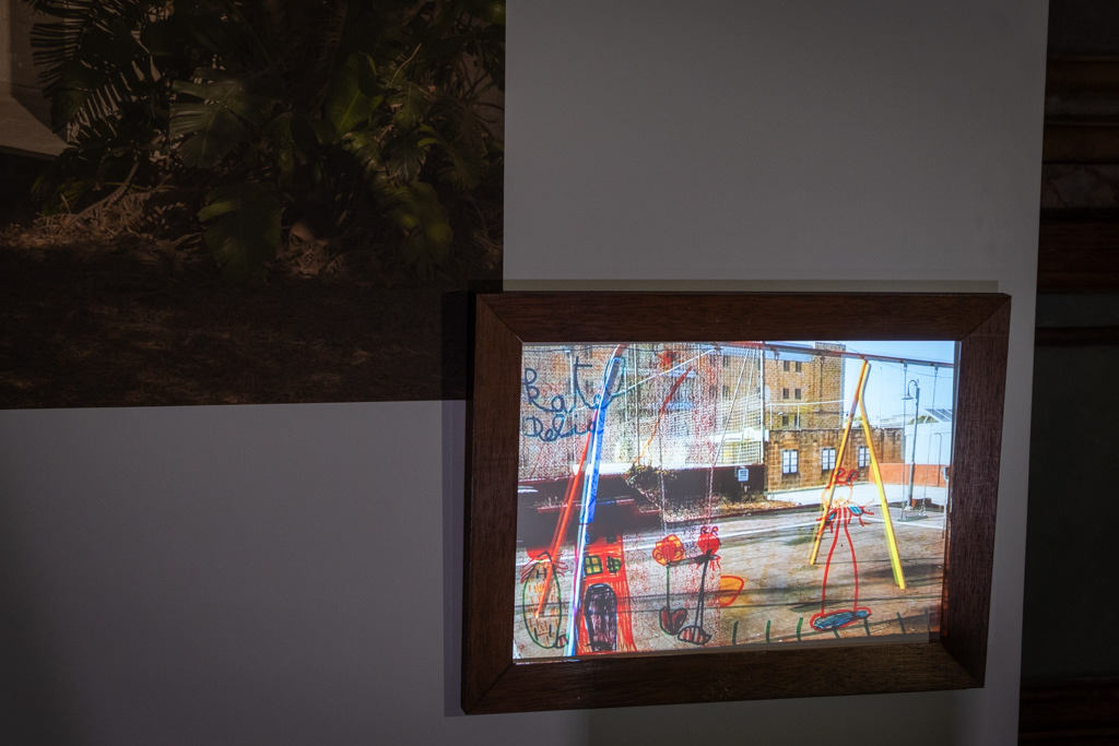 Short photography film, projected into a wood frame.