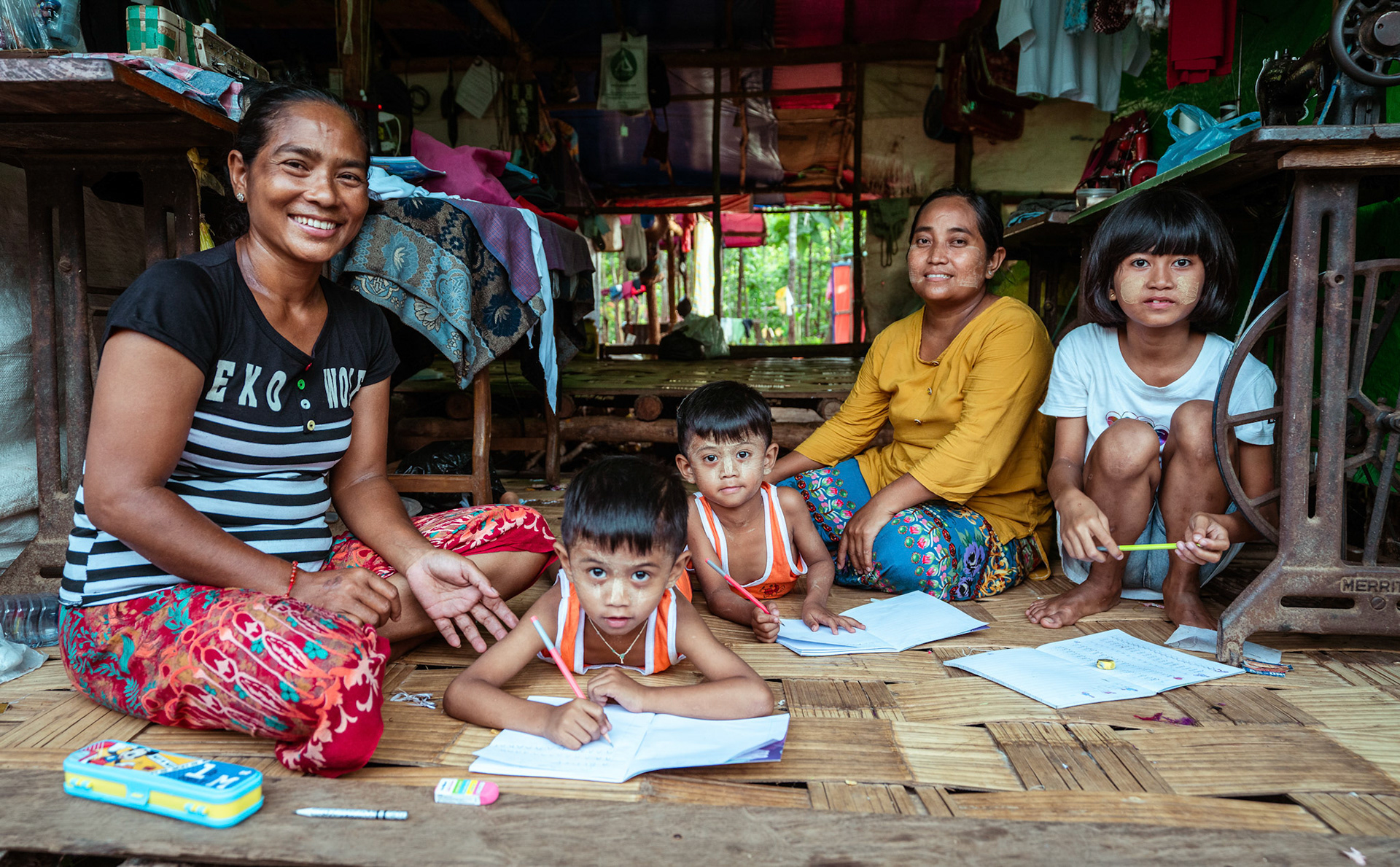 Mothers tutoring their children after attending skill development and adult education modules organised by members of CRS in Moreh, Manipur.
