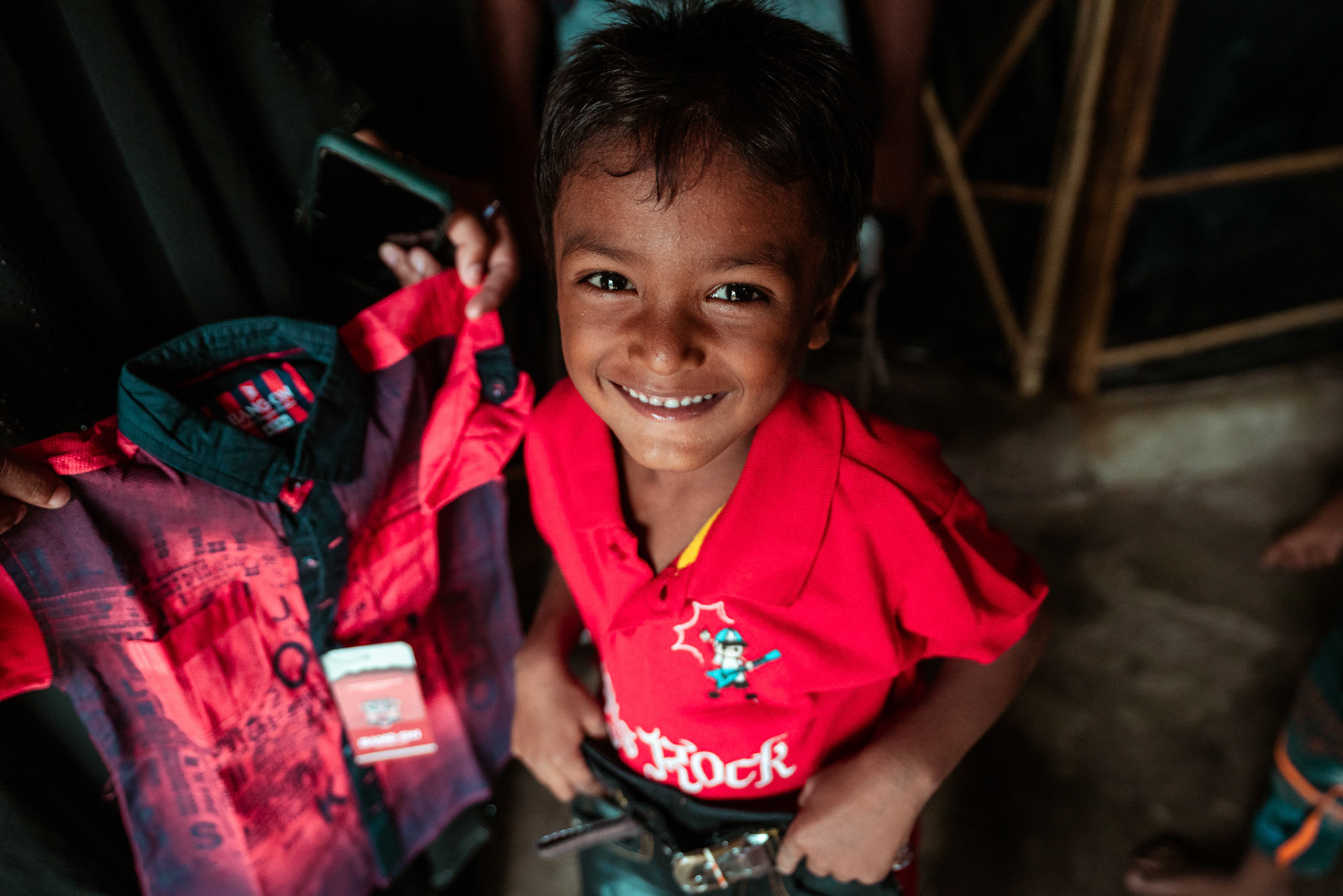 Children after collecting basic needs supplies distributed by members of Development and Justice Initiative (DAJI) an implementing partner of Catholic Relief Services (CRS) in Mewat, Haryana.