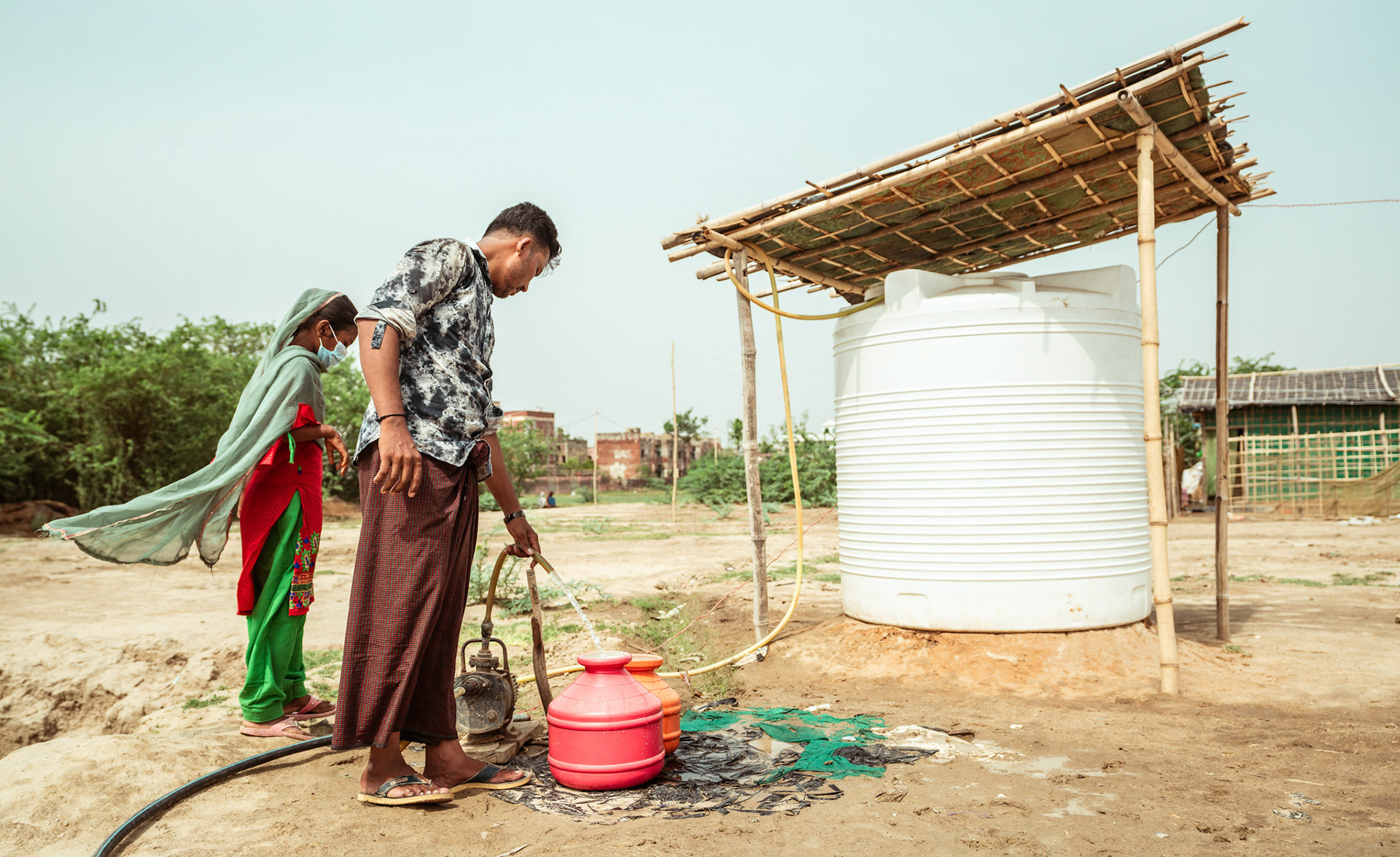 Rohingya Refugees in Mewat, Haryana, at the pum installed under the COVID-19 Response and Recovery Program organised by Catholic Relief Services (CRS).