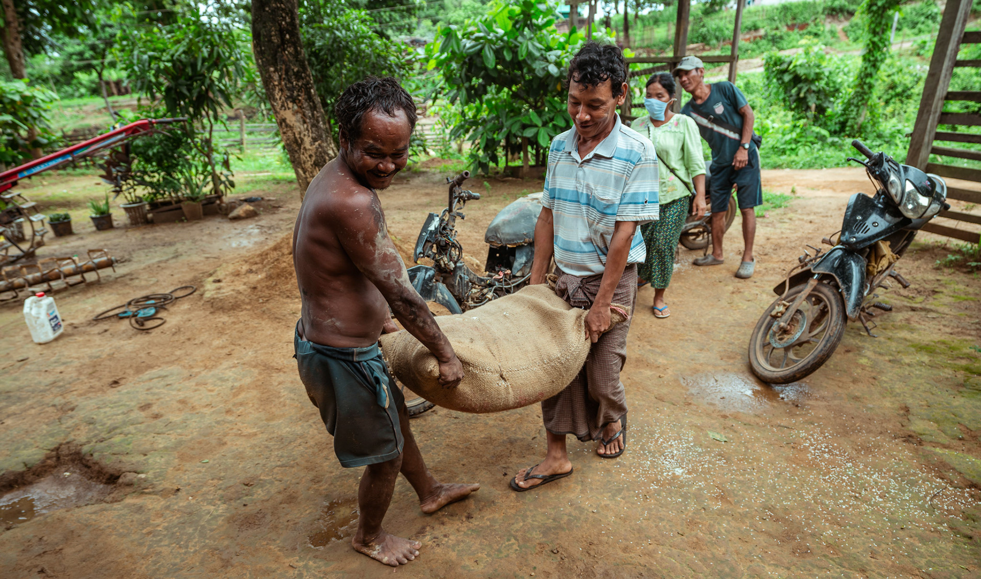 Beneficiaries in Moreh, Manipur, bringing home the basic need supplies and COVID recovery kits distributed by Catholic Relief Services (CRS) during the Voucher Based Distribution scheme.