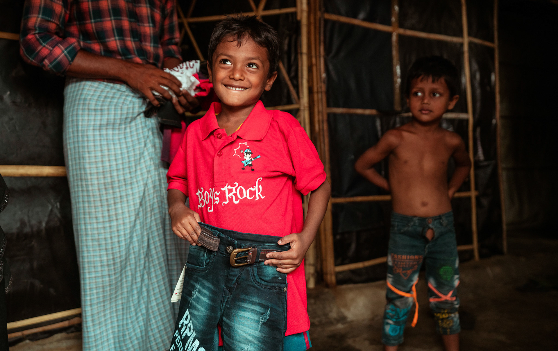 Children after collecting basic needs supplies distributed by members of Development and Justice Initiative (DAJI) an implementing partner of Catholic Relief Services (CRS) in Mewat, Haryana.
