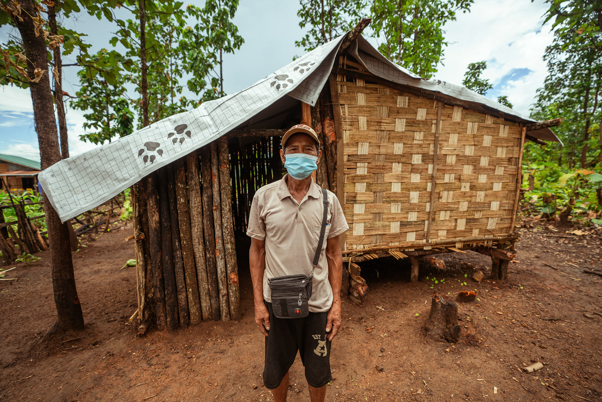 Refugees in Moreh, Manipur, covering their roof with tarpaulin sheets received from the Voucher Based Distribution of basic need supplies and COVID recovery kits among People of Concern (POC) in Moreh, Manipur organised by Catholic Relief Services (CRS).