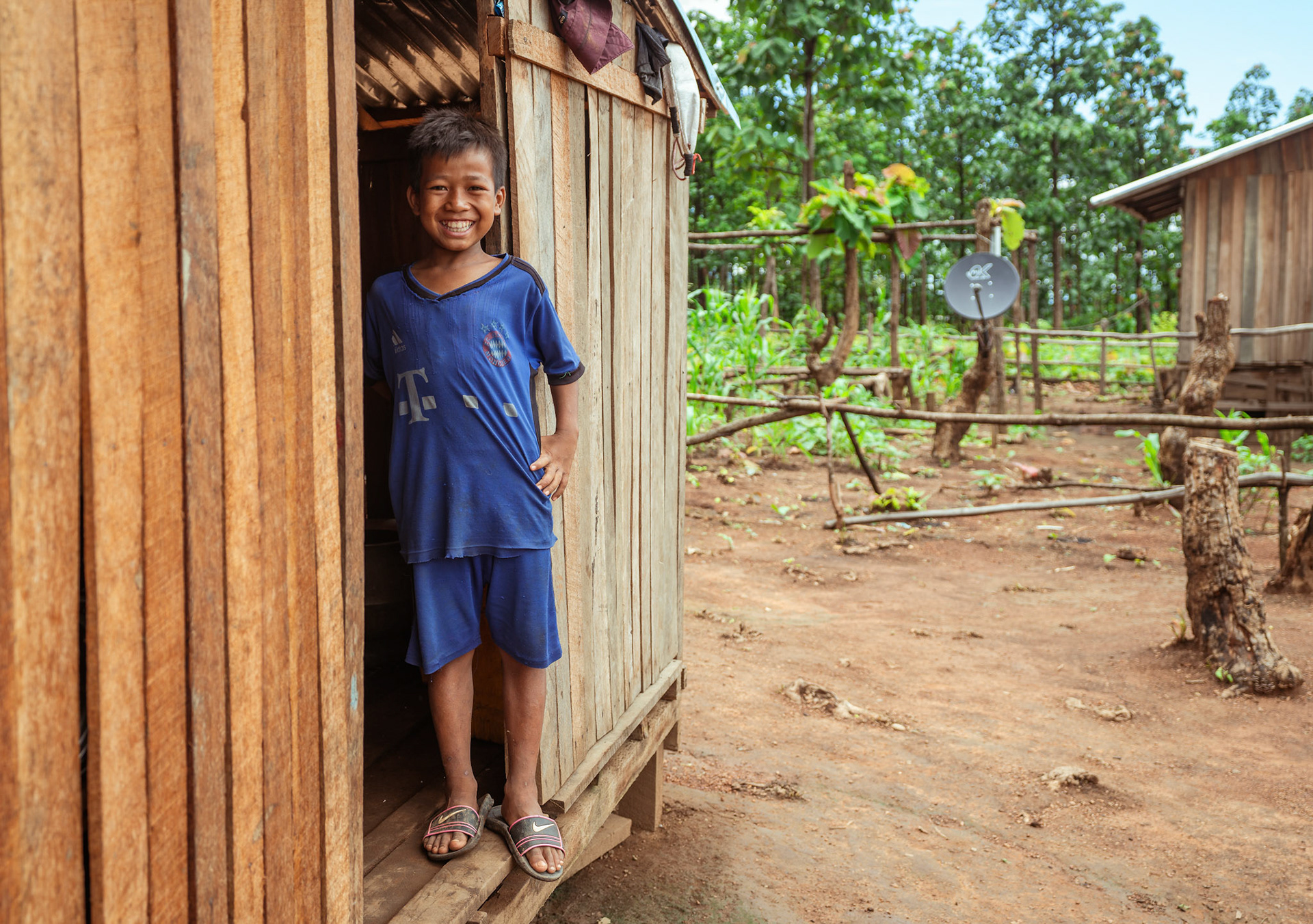 A refugee stands a the entrace of his house in Moreh, Manipur, captured during the COVID recovery program organised by Catholic Relief Services (CRS).