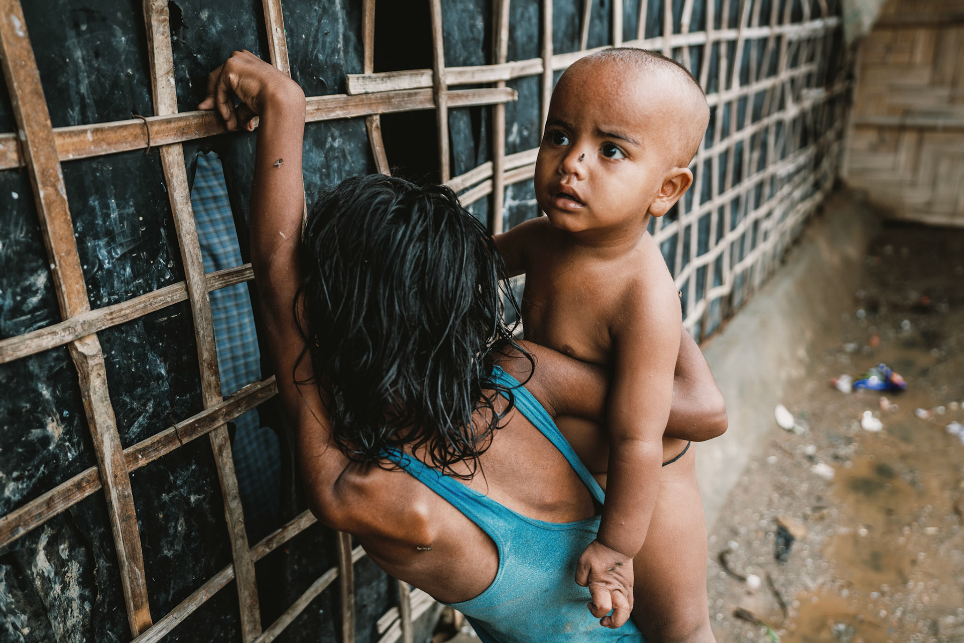 Siblings standing outside their home during the COVID-19 Response and Recovery Program in Mewat, Haryana.