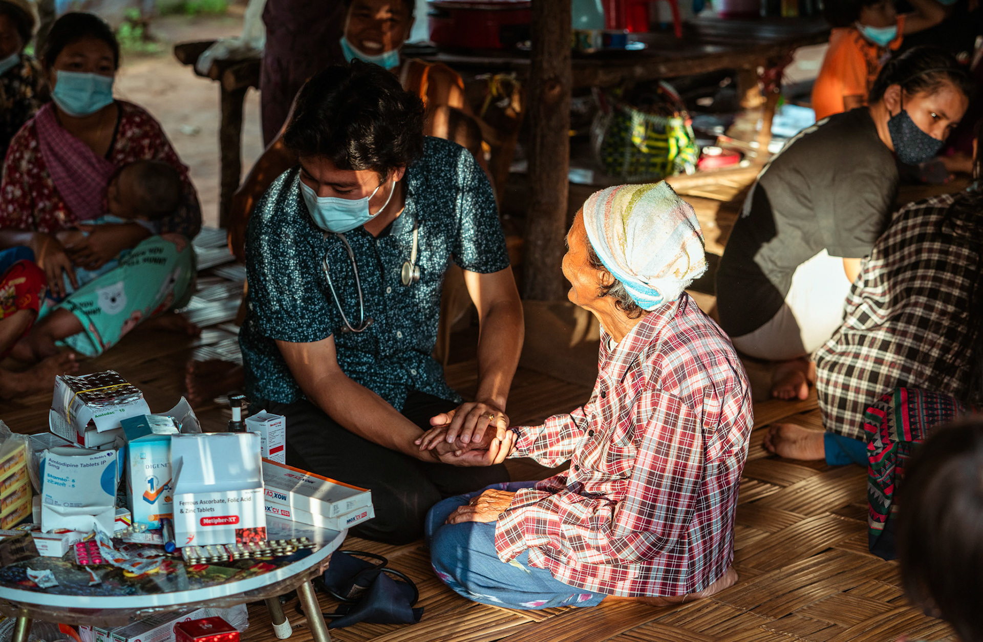 A senior citizen consulting the doctor at a medical camp in Moreh, Manipur, organised for refugees by Catholic Relief Services (CRS).